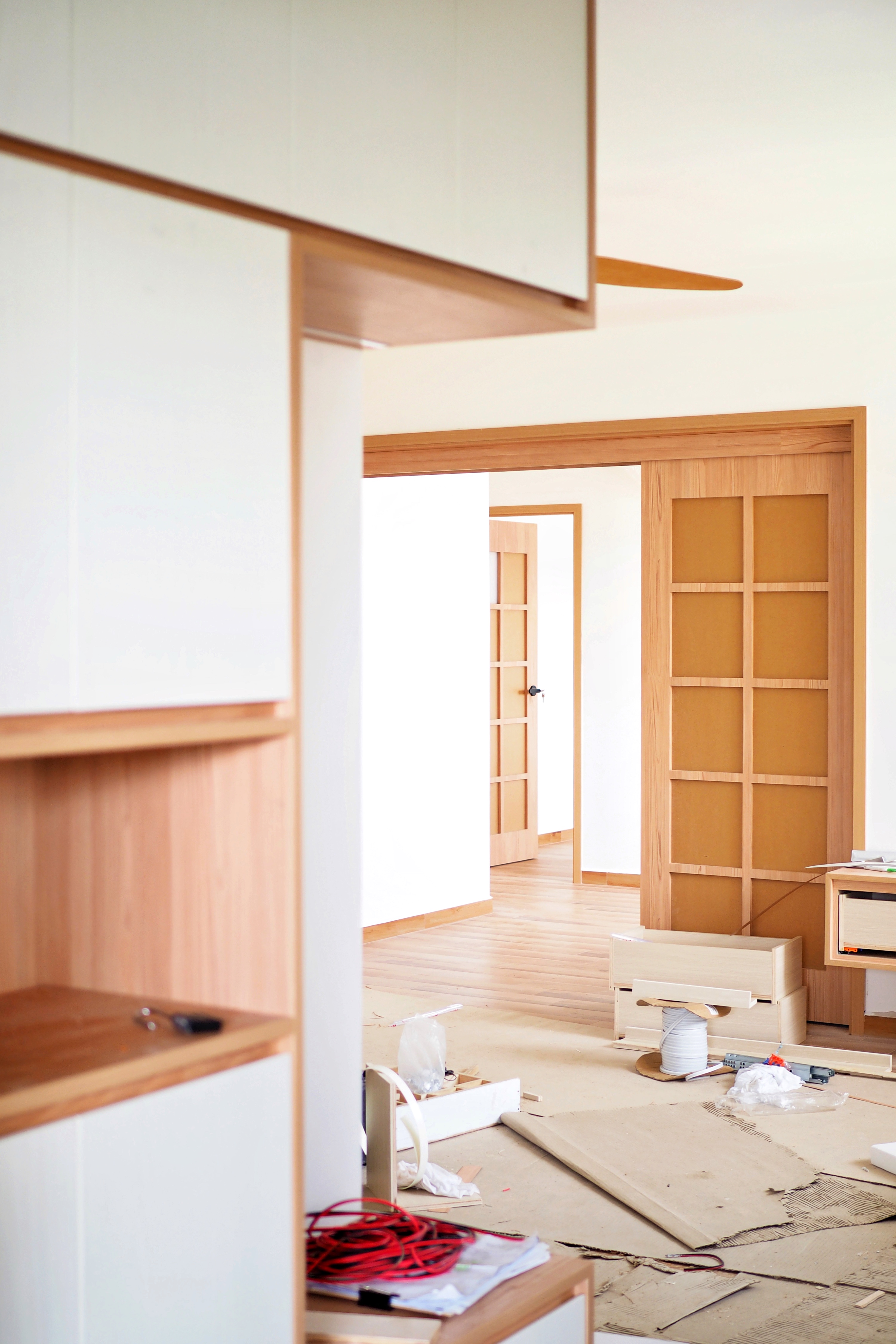 A Japanese-Inspired 4-Room Resale Flat in the North-East - Wooden cabinetry, unfinished room, wooden shelves, wooden door