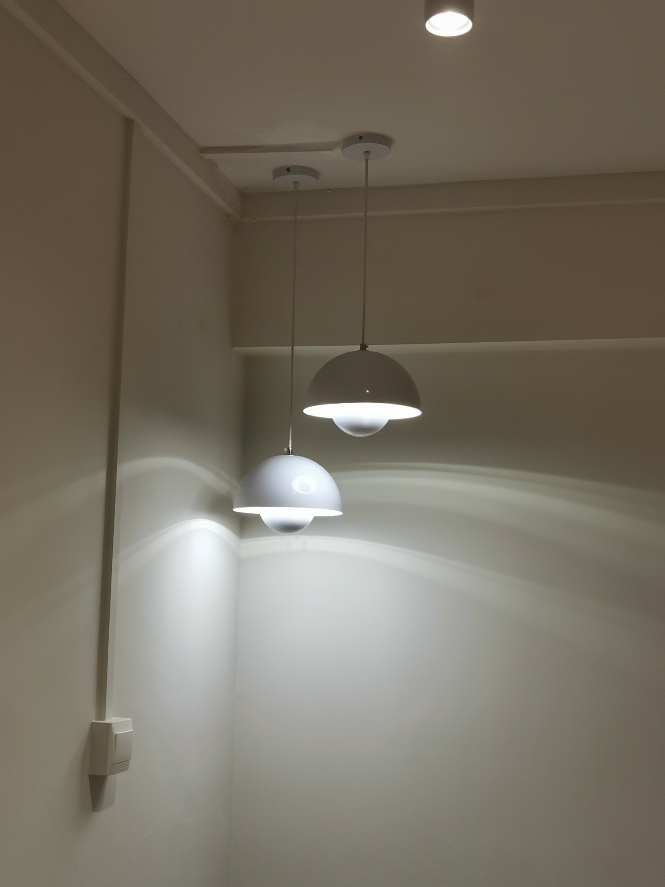 5 Lighting Ideas to Create Mood in your Home - Modern minimalist design, soft ambient lighting, sleek pendant lights, white