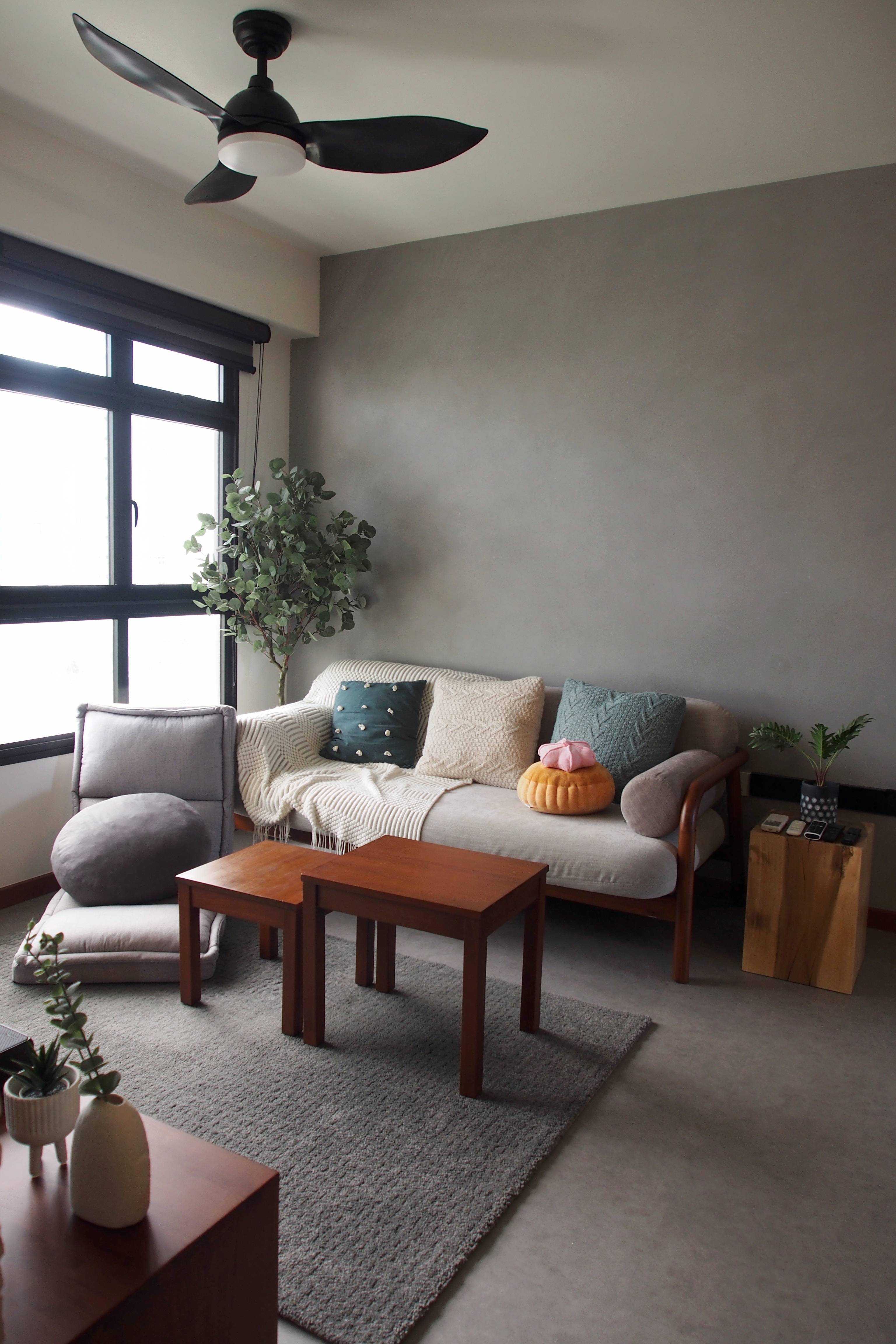 Scandi-industrial city fringe BTO with minimal built-ins - Modern living room with gray walls, large window with black