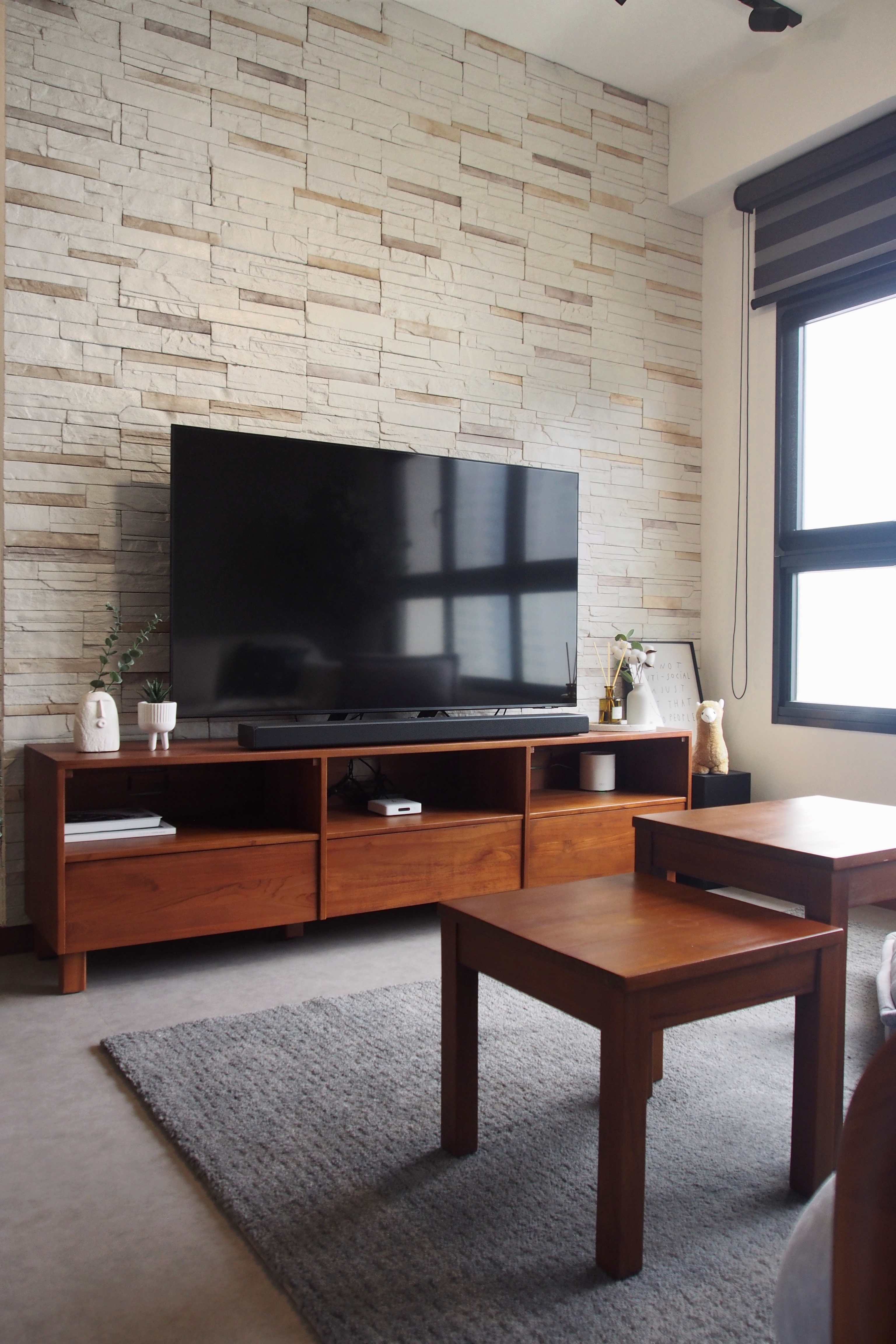 Scandi-industrial city fringe BTO with minimal built-ins - stone wall, modern living room, wooden TV stand, minimalist decor