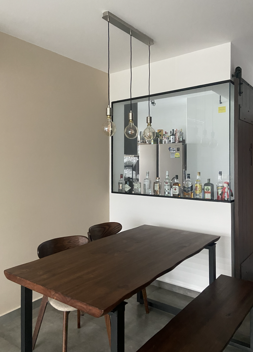 Slow living @slow.ferns - modern bar area, minimalist design, wooden dining table, pendant lights, sleek cabinetry, built-in