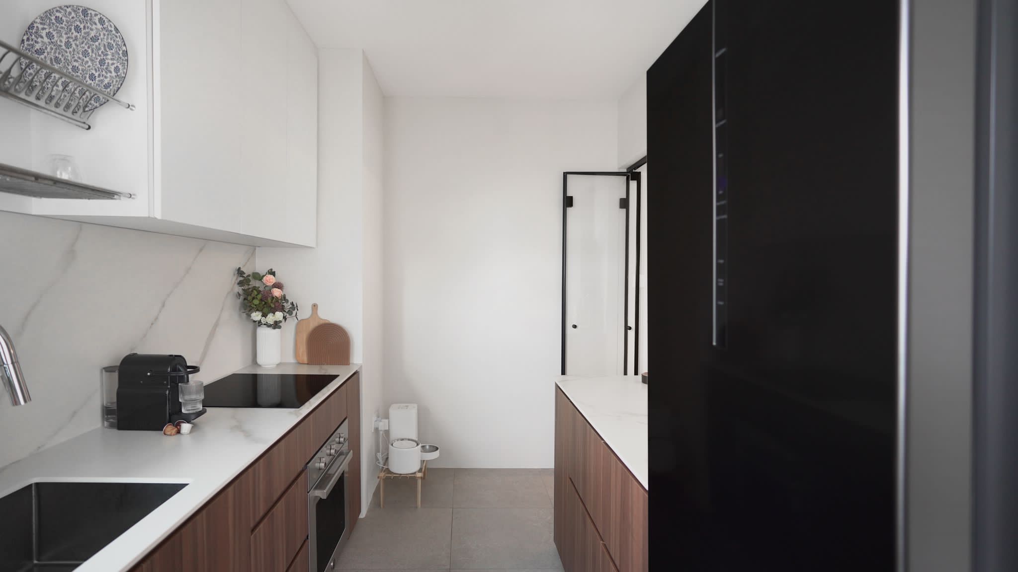 Kitchen's BEFORE/AFTER - White marble countertop, modern kitchen, stainless steel sink, black coffee machine, wooden