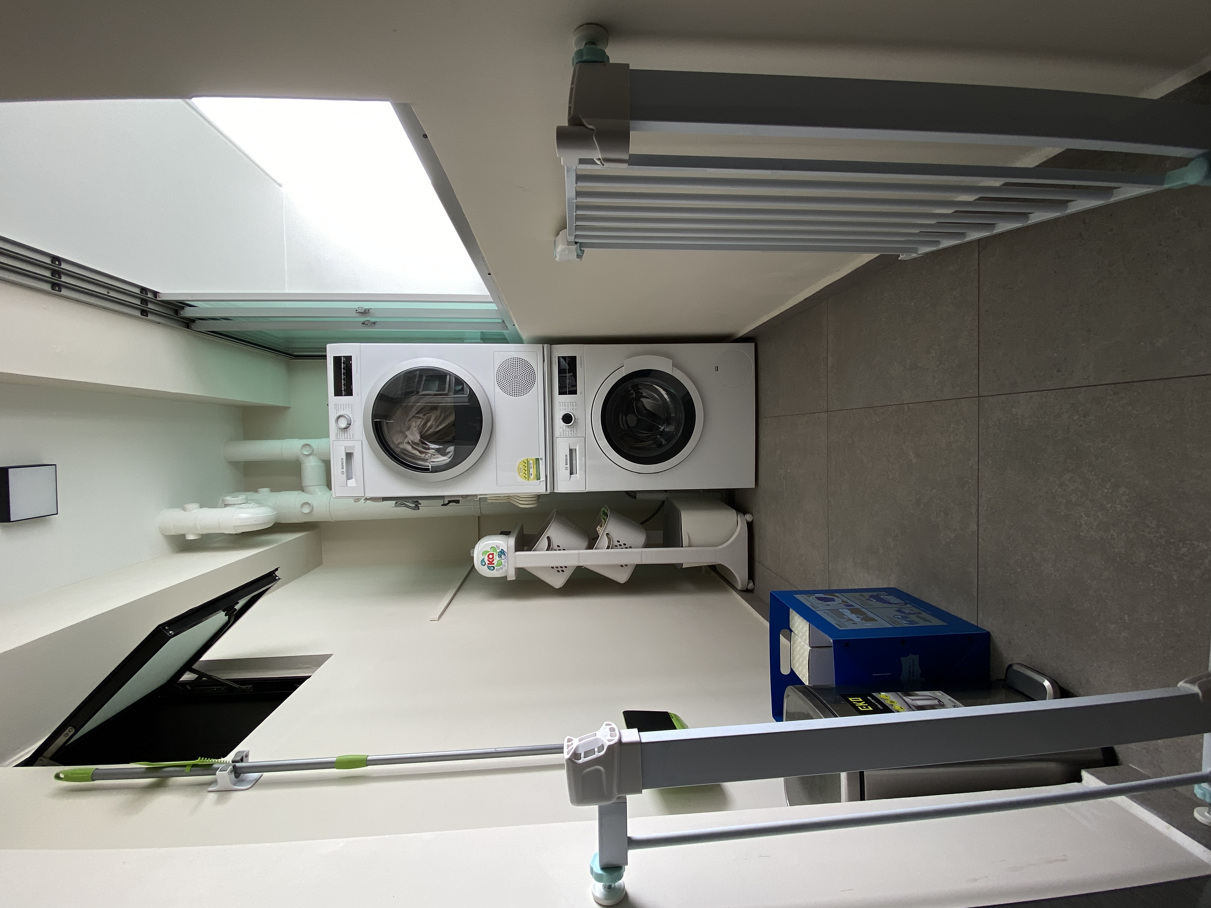 Where we usually spend our Wednesdays and Sundays - Mini washer and dryer unit, modern design, white appliances, integrated