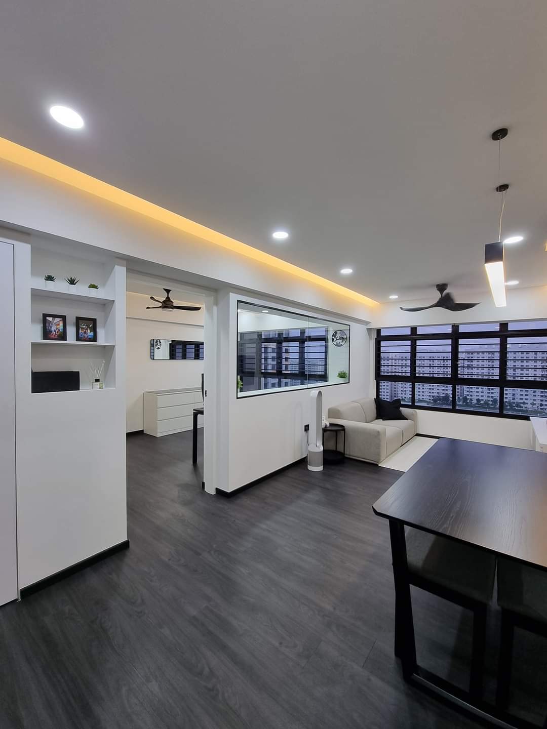 Our Beautiful Black & White - Modern living room with sleek design, large windows, contemporary furniture, dark wood