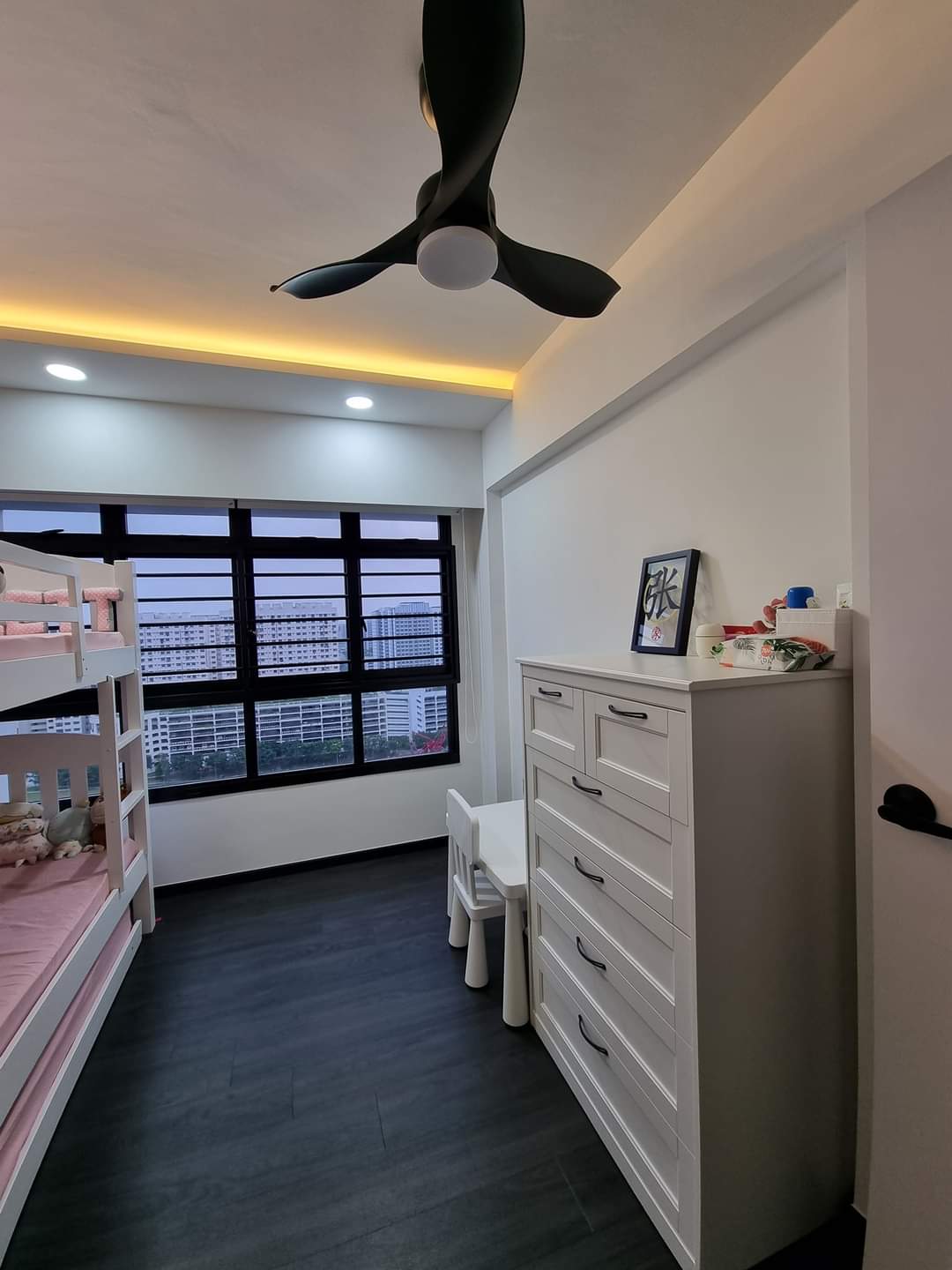 Our Beautiful Black & White - Modern bedroom with bunk beds, white ceiling fan, large window with city view, black and white