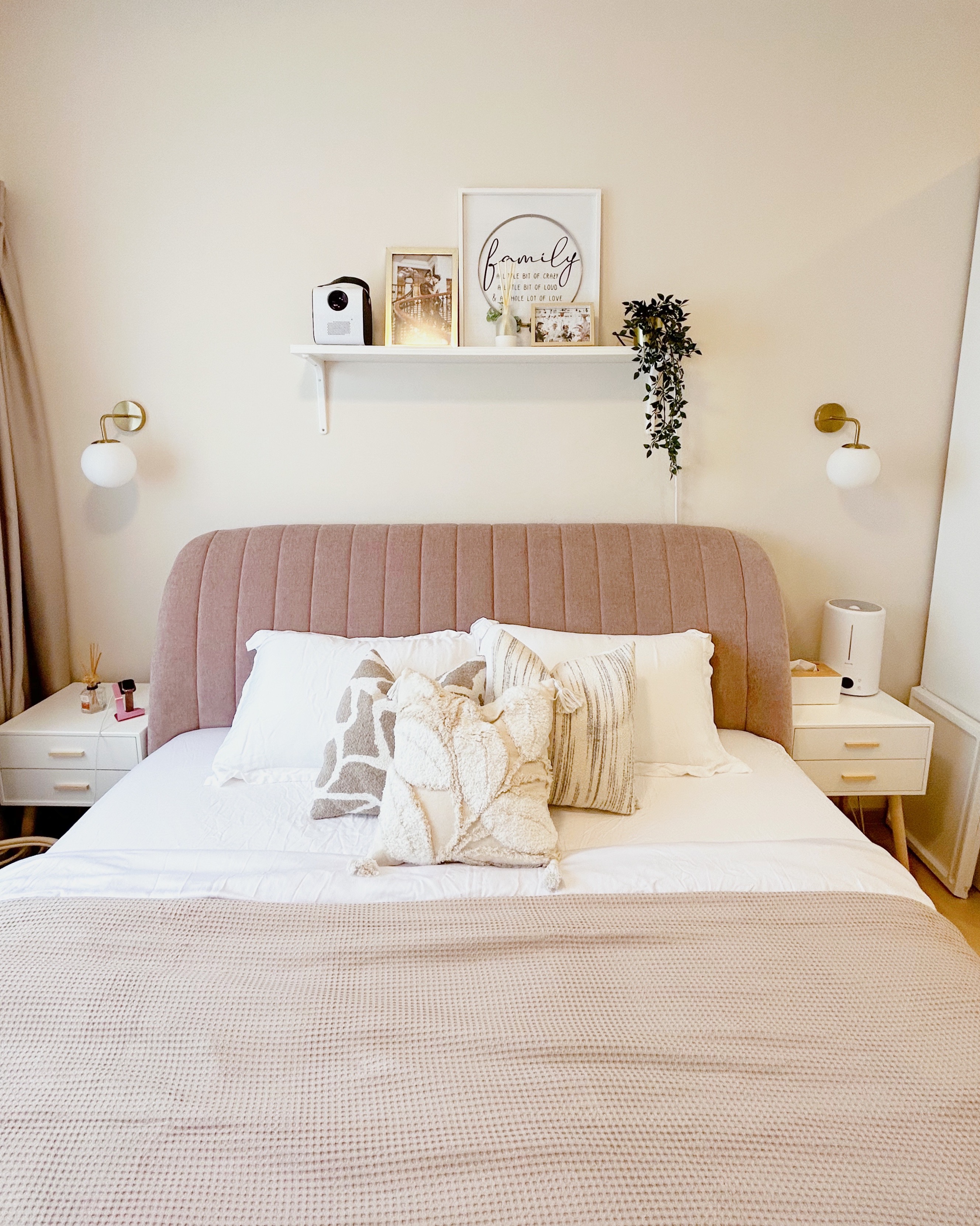 Our cosy master bedroom  - Soft pink upholstered headboard, white bedding, plush throw pillows, beige and white accent