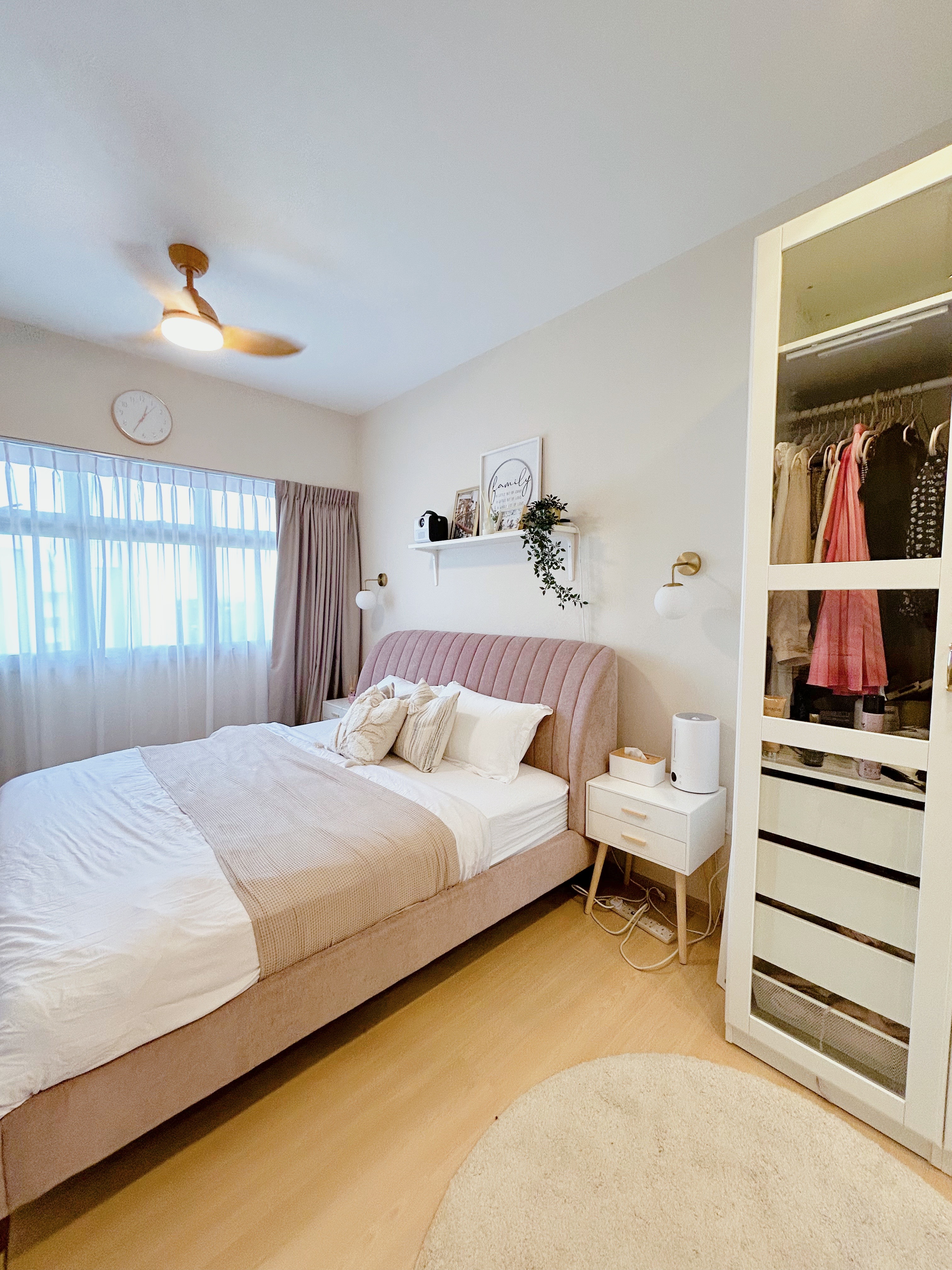 Our cosy master bedroom  - Light-colored bedroom with neatly made bed, soft pink headboard, white bedding, beige curtains