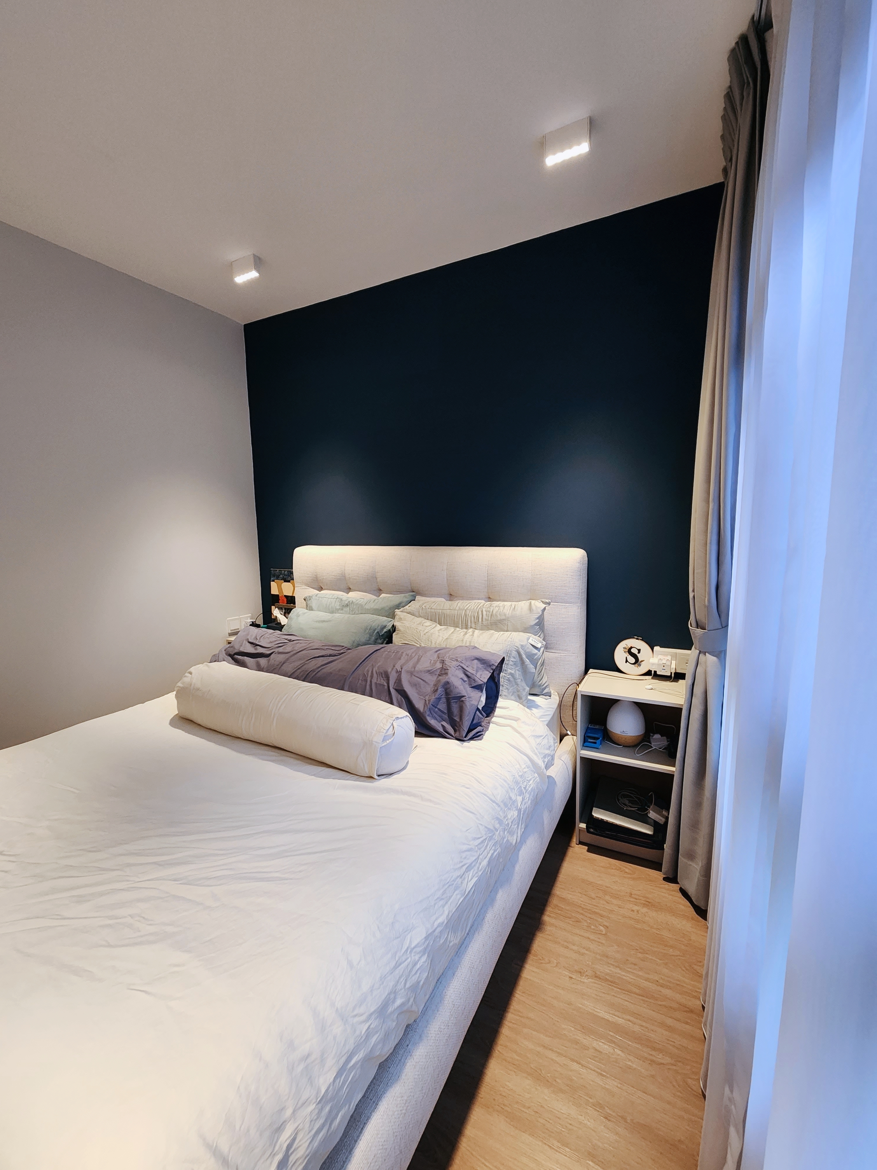 It's a dream come true! Walk in Wardrobe in a 4-rm BTO Masterbedroom - Modern bedroom with neatly made bed, white and blue