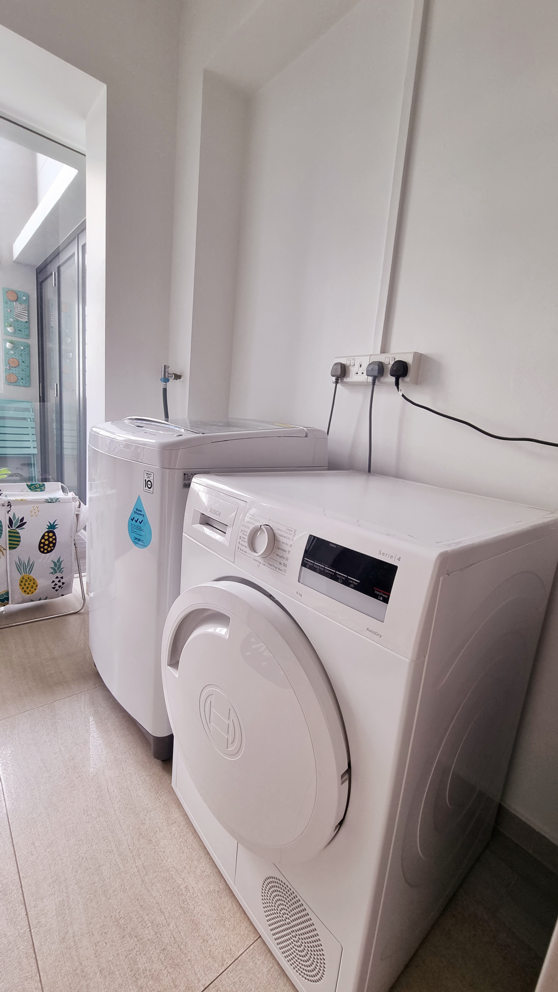 Where we do our laundry with POP OF COLOURS  - Washing machine, front-loading, modern, white, stacked, stacked washer, dual