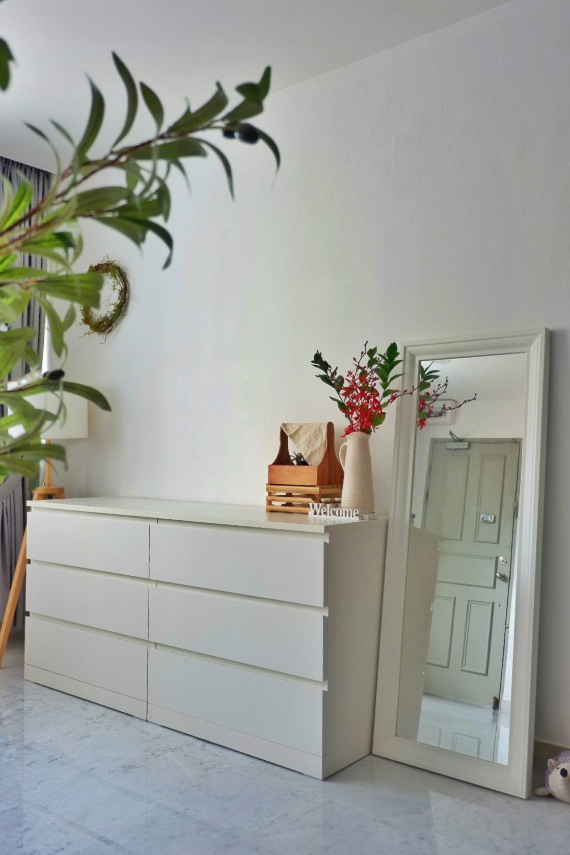 Home styling ideas - just the way you like! - White minimalist dresser, modern decor, green plant, wooden shelf, white