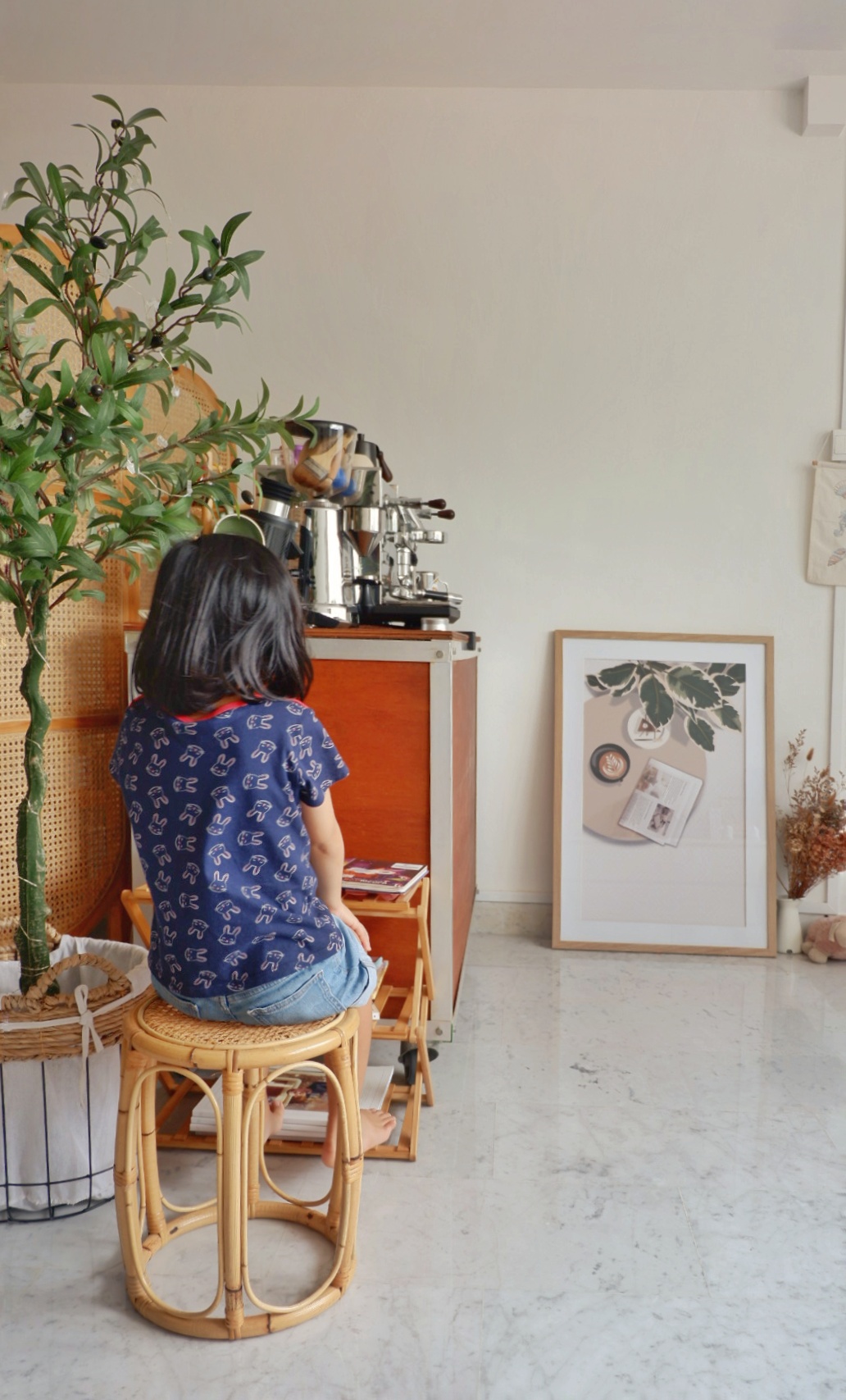 Home styling ideas - just the way you like! - woven stool, young girl, sitting, plant, natural light, indoor setting, cozy