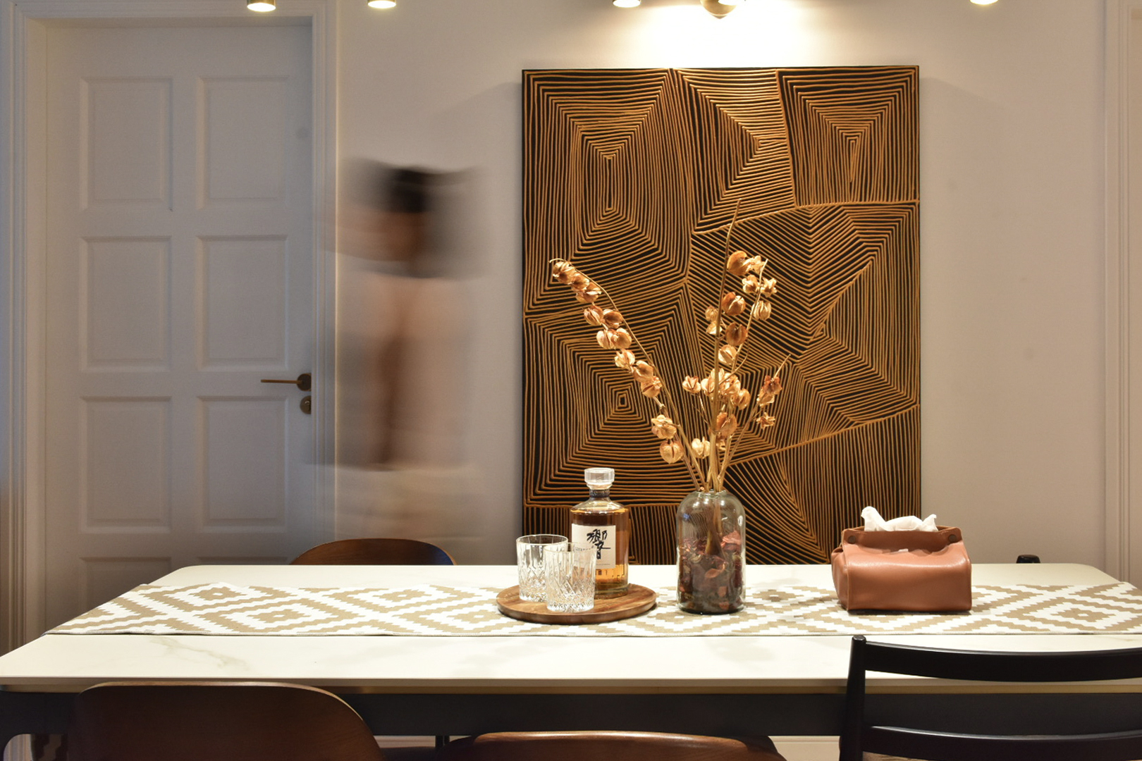 Tips and Tricks for a Stylish Sanctuary - modern dining room, abstract art, geometric pattern, wooden door, minimalist decor