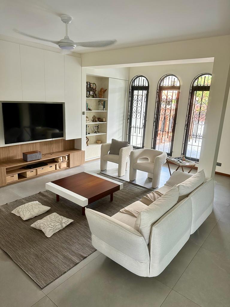 Living in simplicity where less is more - Modern living room with minimalist design, large flat-screen TV, built-in shelving