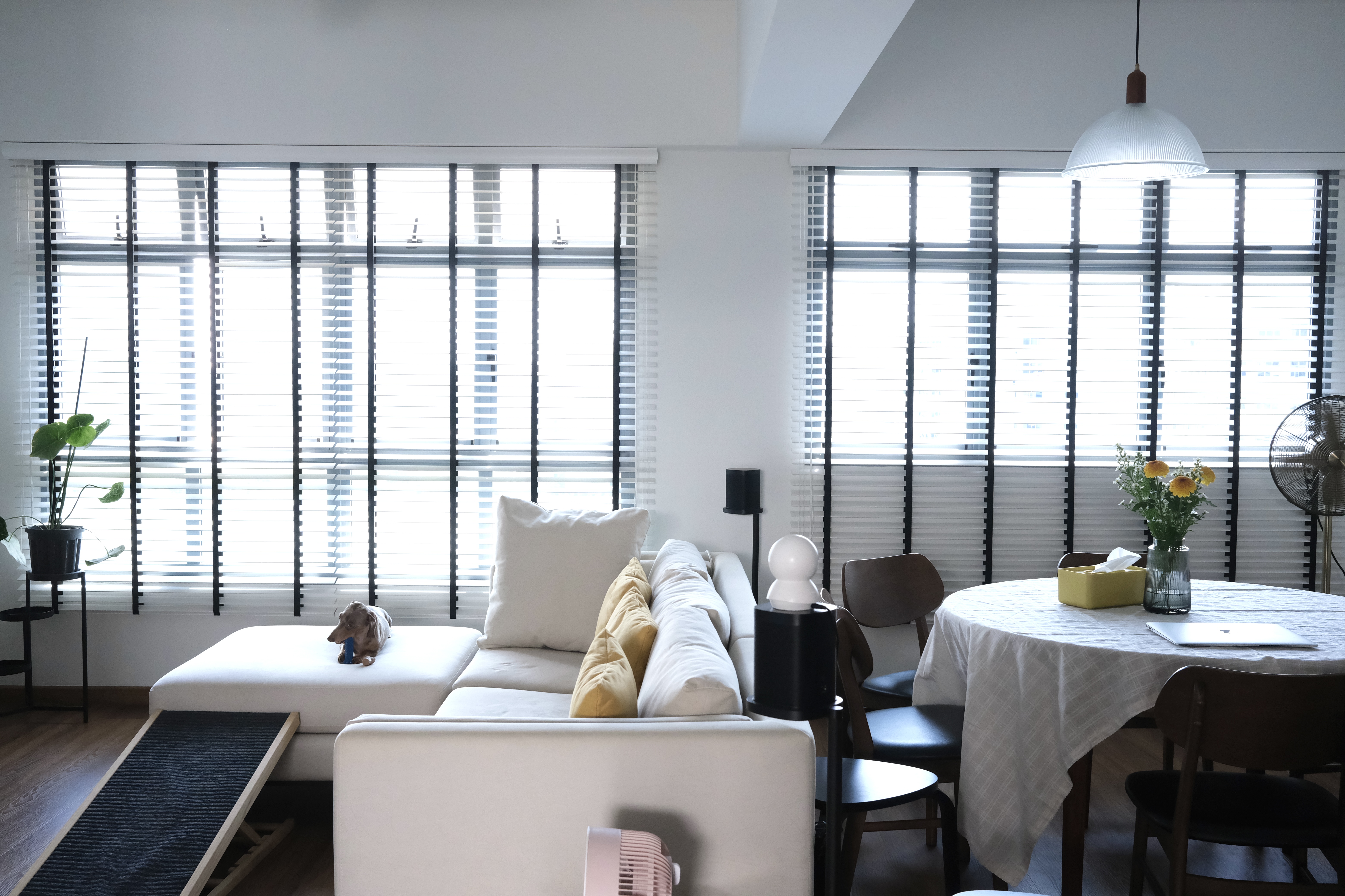 Our Living Room | Where we Netflix & Chill - Modern living room with large windows, white and black blinds, minimalist
