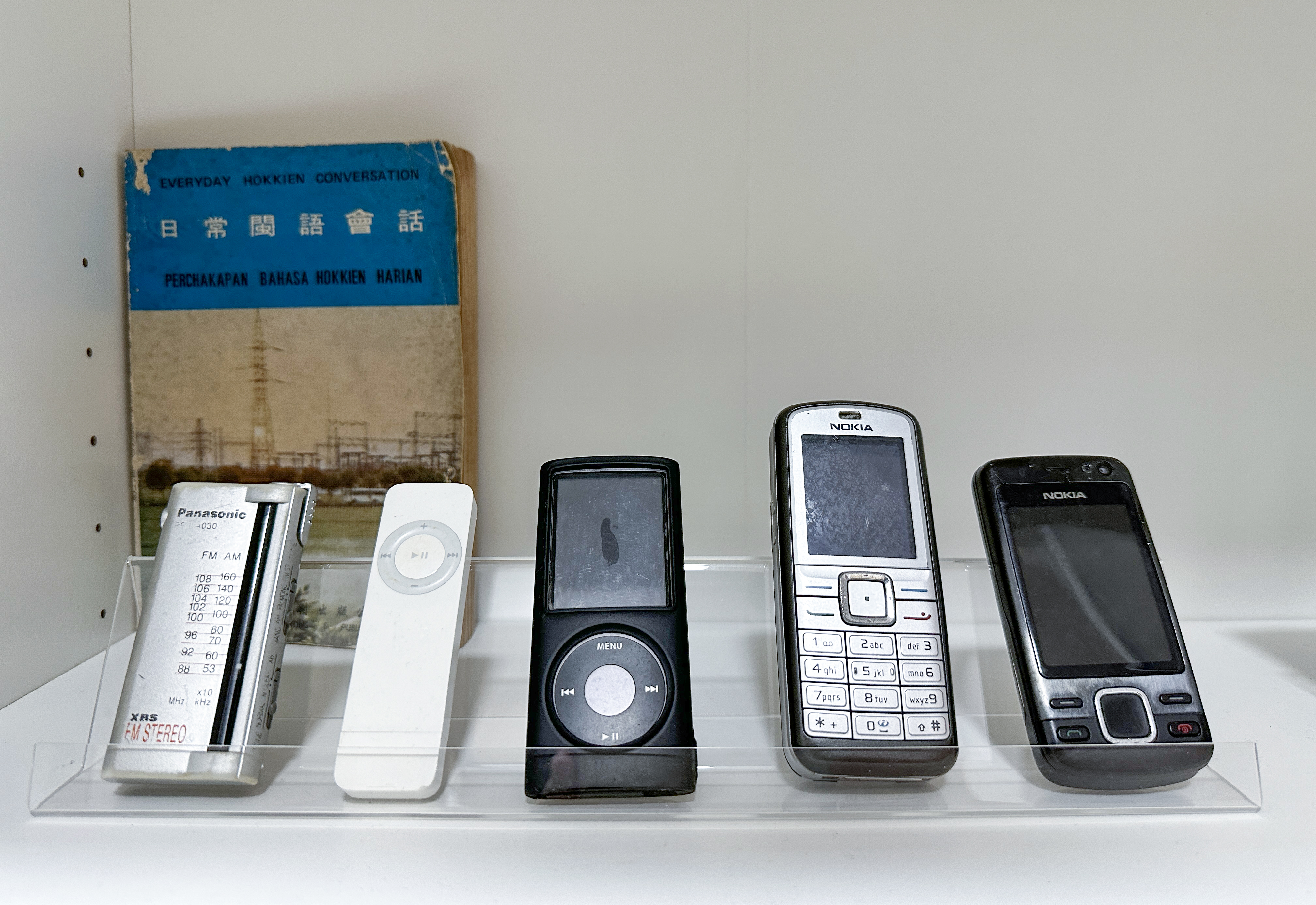 Our Happy Aesthetic Coffee Corner & Entryway - Panasonic FM AM radio, white remote control, black iPod dock, Nokia mobile