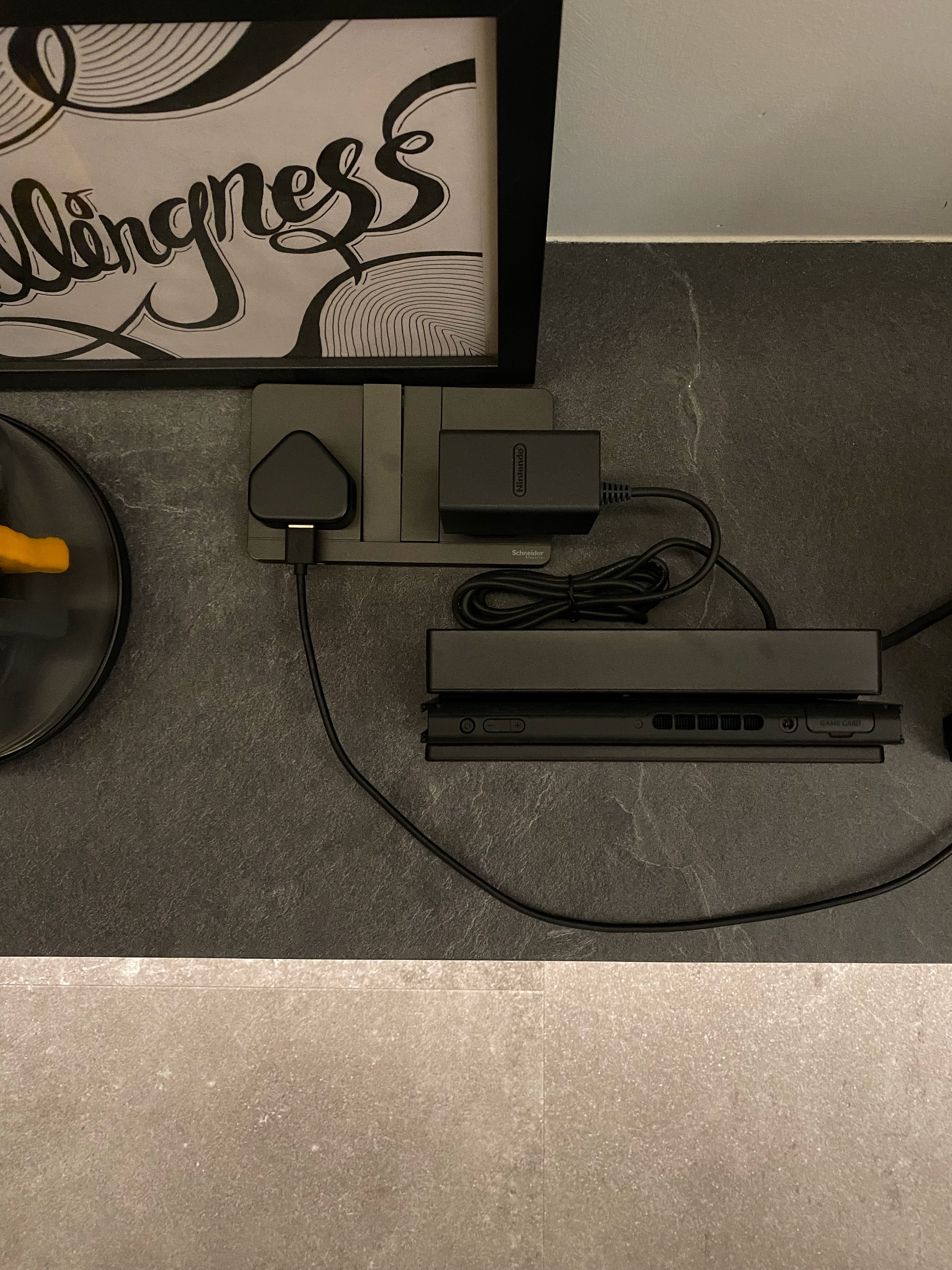 Once you go black, you never go back. That's what they said. - Charging station with Nintendo gaming console and power