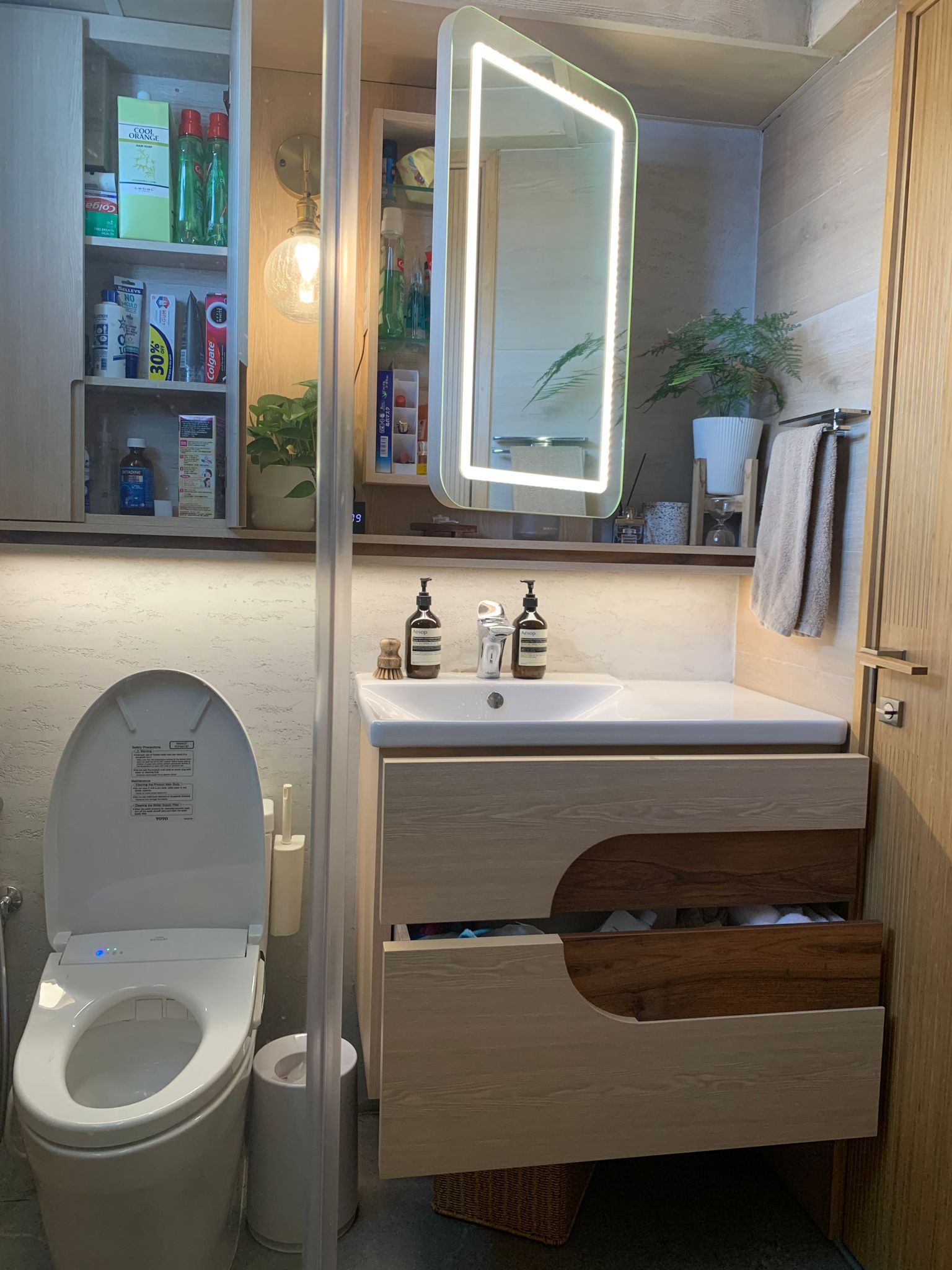 Japanese Inspired Interior | Bathrooms as a space to relax - Wooden bathroom vanity, modern design, white toilet, under-sink