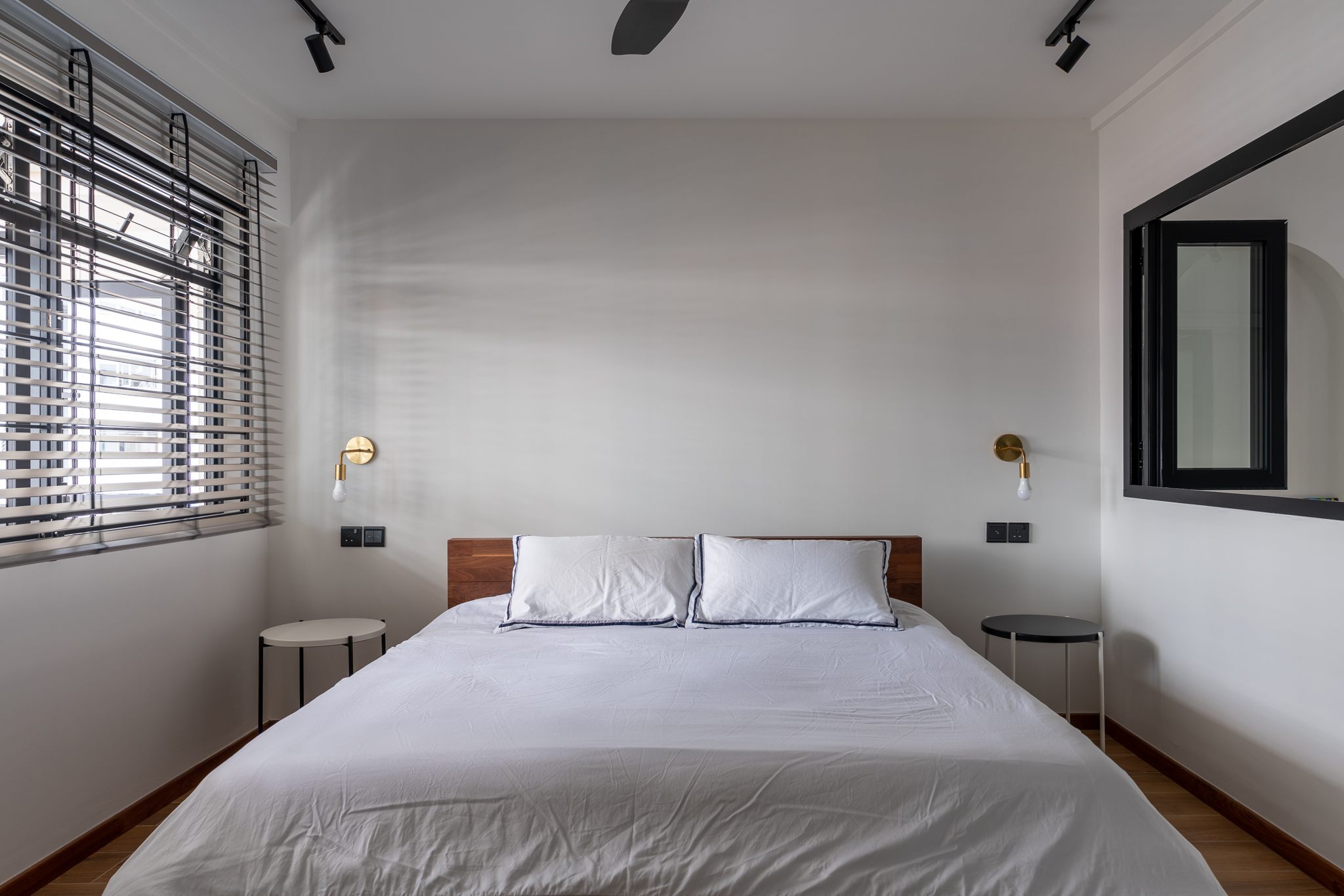 When 2 Becomes 1… Bedroom - Modern minimalist bedroom, white bedding, wooden headboard, two pillows, bedside tables, black