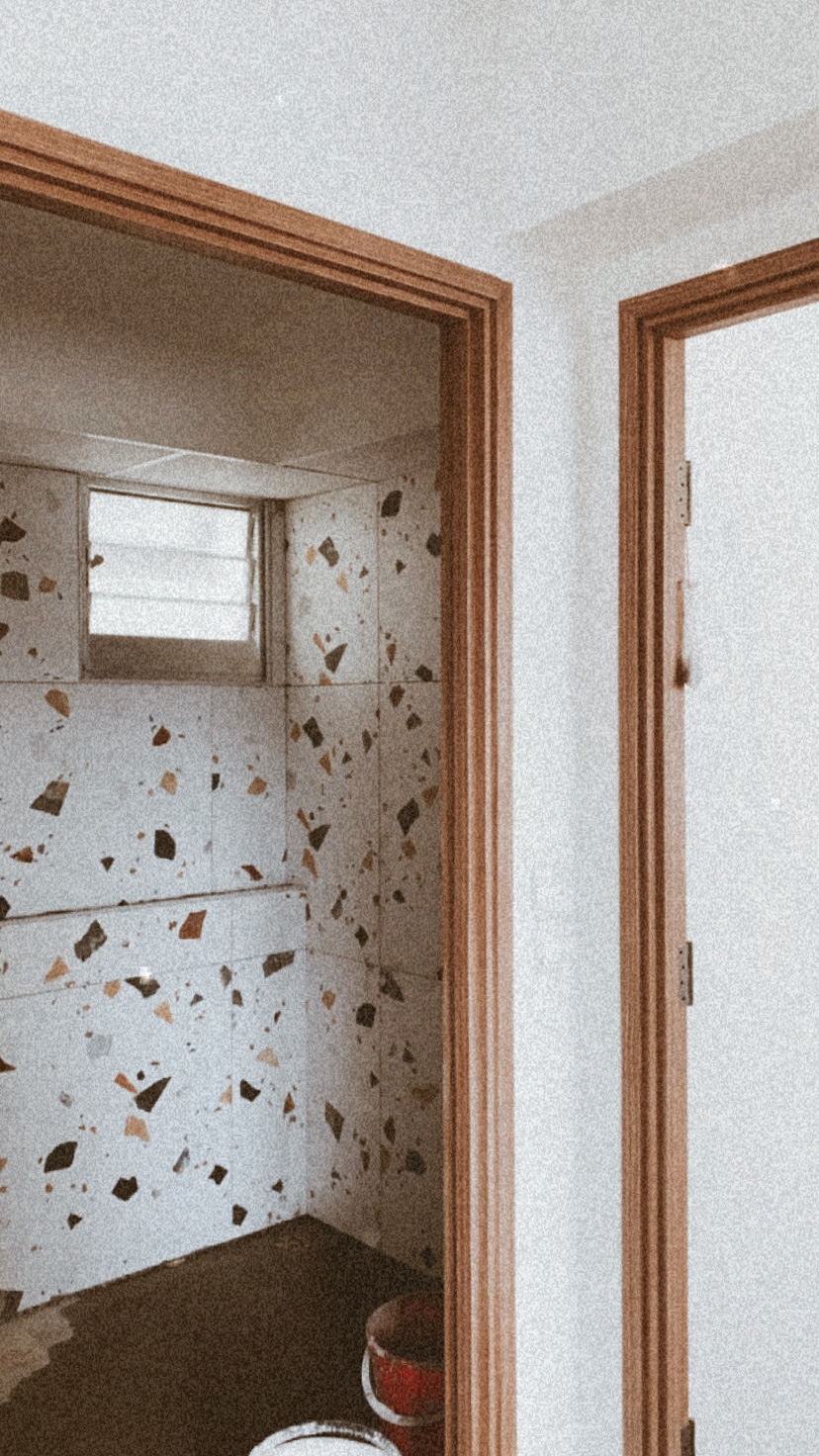 Build Your Own Toilet  - Bathroom, tiled walls, small window, patterned tiles, wooden frame, doorway, light streaming, red