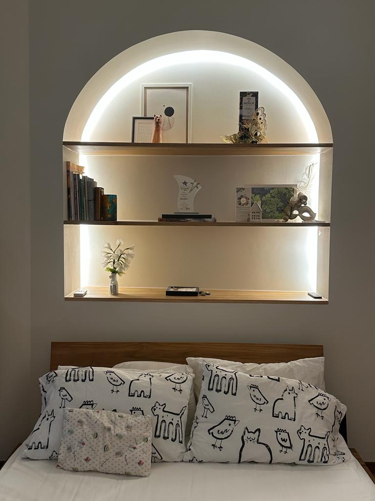 Calming bedroom vibes for Gen Z - Arched alcove, modern decor, minimalist design, built-in shelves, soft lighting, cozy