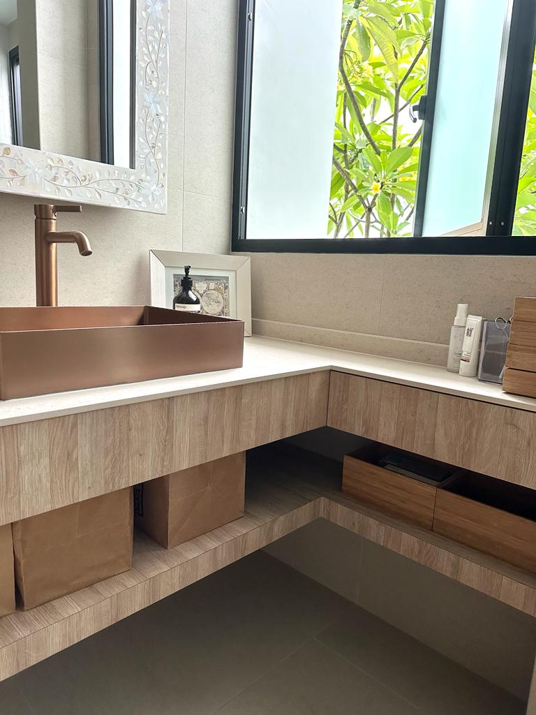 Calming bedroom vibes for Gen Z - Modern bathroom vanity with copper sink, wooden countertop, built-in storage, large mirror