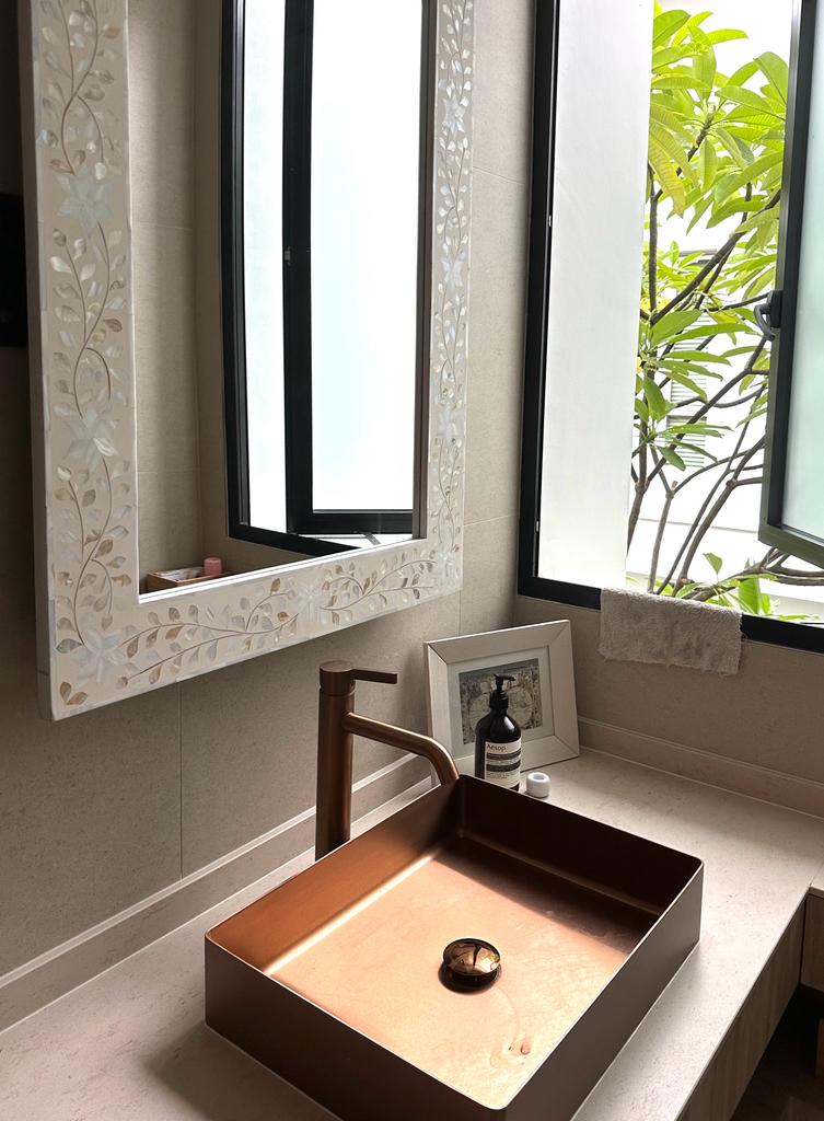 Calming bedroom vibes for Gen Z - Bathroom vanity with copper fixtures, rectangular sink, modern design, minimalist decor