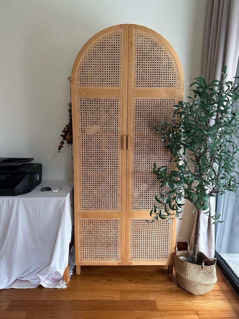 Calming bedroom vibes for Gen Z - Wooden arched cabinet with intricate lattice design, set in a minimalist room, featuring a