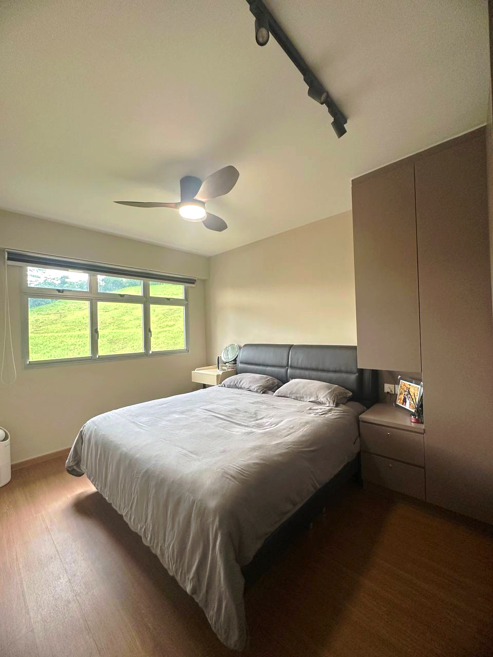 Embracing Simplicity - The Beige Minimalist Haven 🏠 - Modern bedroom with large bed, beige walls, wooden floor, ceiling fan