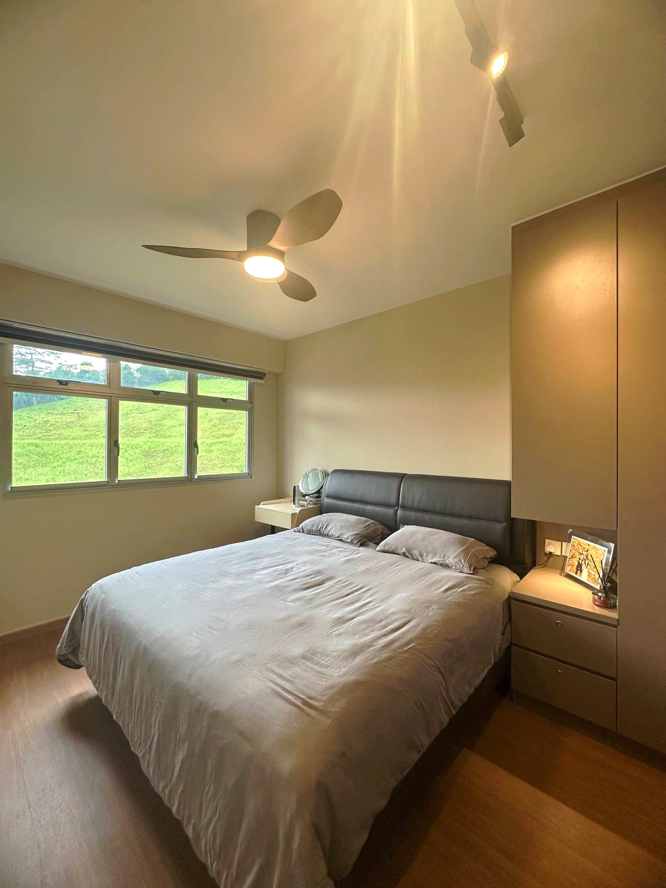 Embracing Simplicity - The Beige Minimalist Haven 🏠 - Modern bedroom with large bed, beige walls, wooden floor, ceiling fan