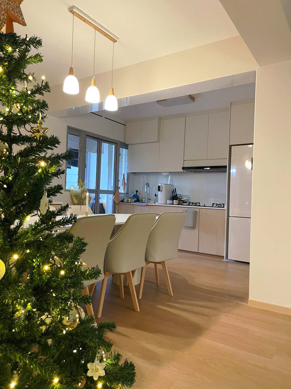 Embracing Simplicity - The Beige Minimalist Haven 🏠 - Glamorous Christmas tree adorned with lights and ornaments, surrounded