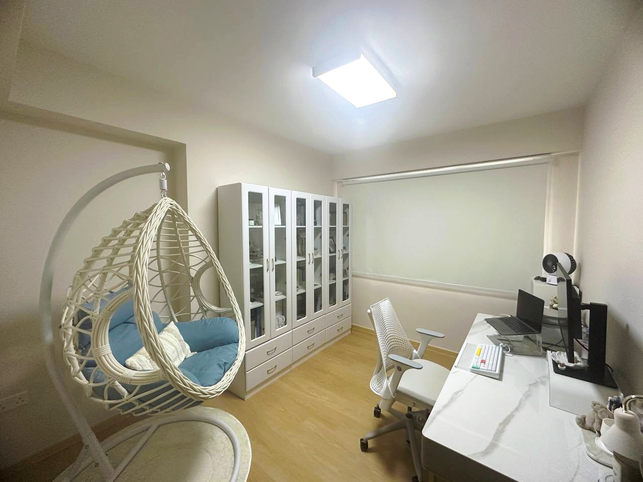 Embracing Simplicity - The Beige Minimalist Haven 🏠 - Woven baby swing, white and blue cushion, indoor play area, cozy