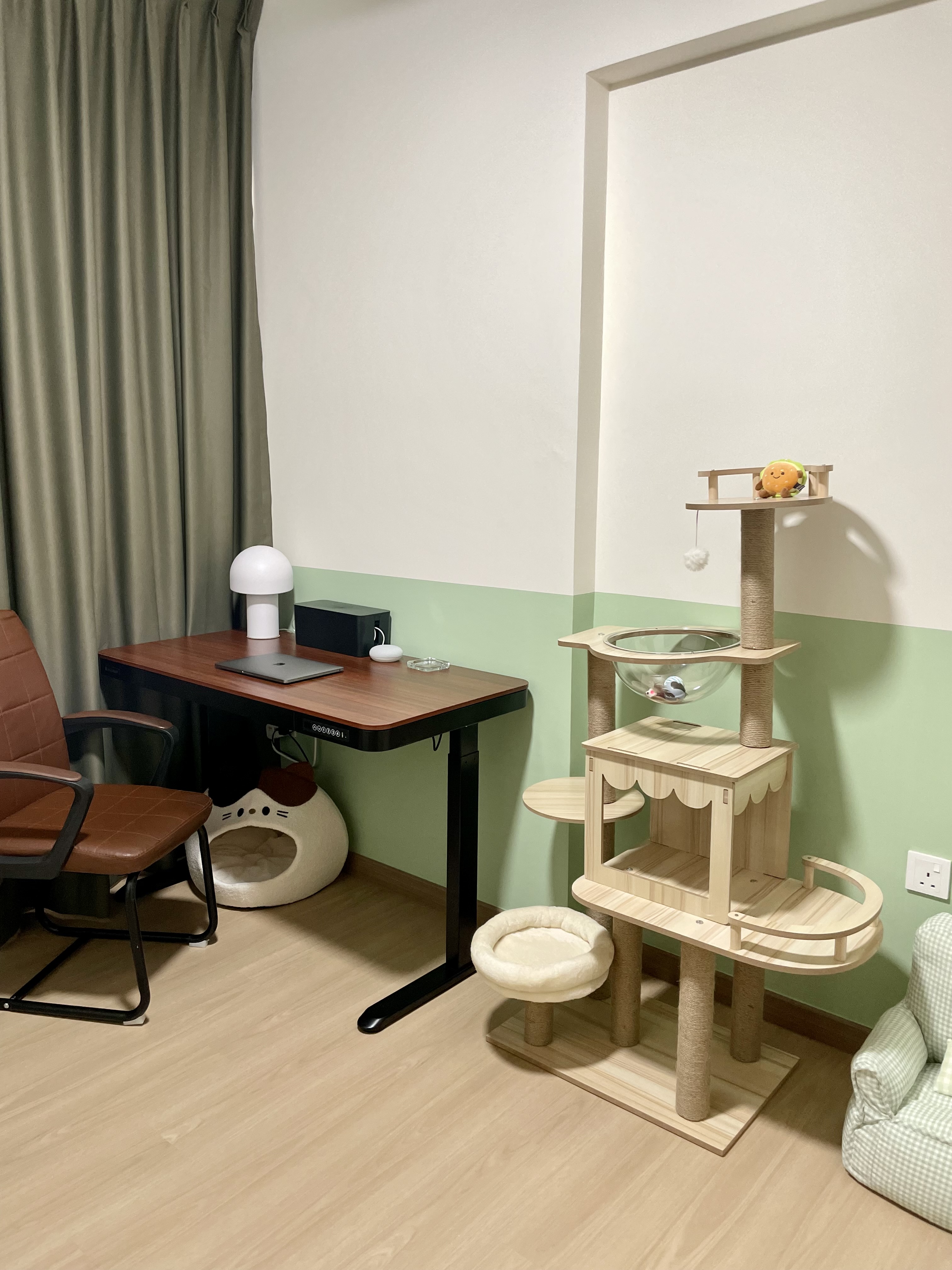 Multipurpose Room - Study + Cat Room - Wooden cat tree, beige and brown cat bed, green and white striped armchair, brown