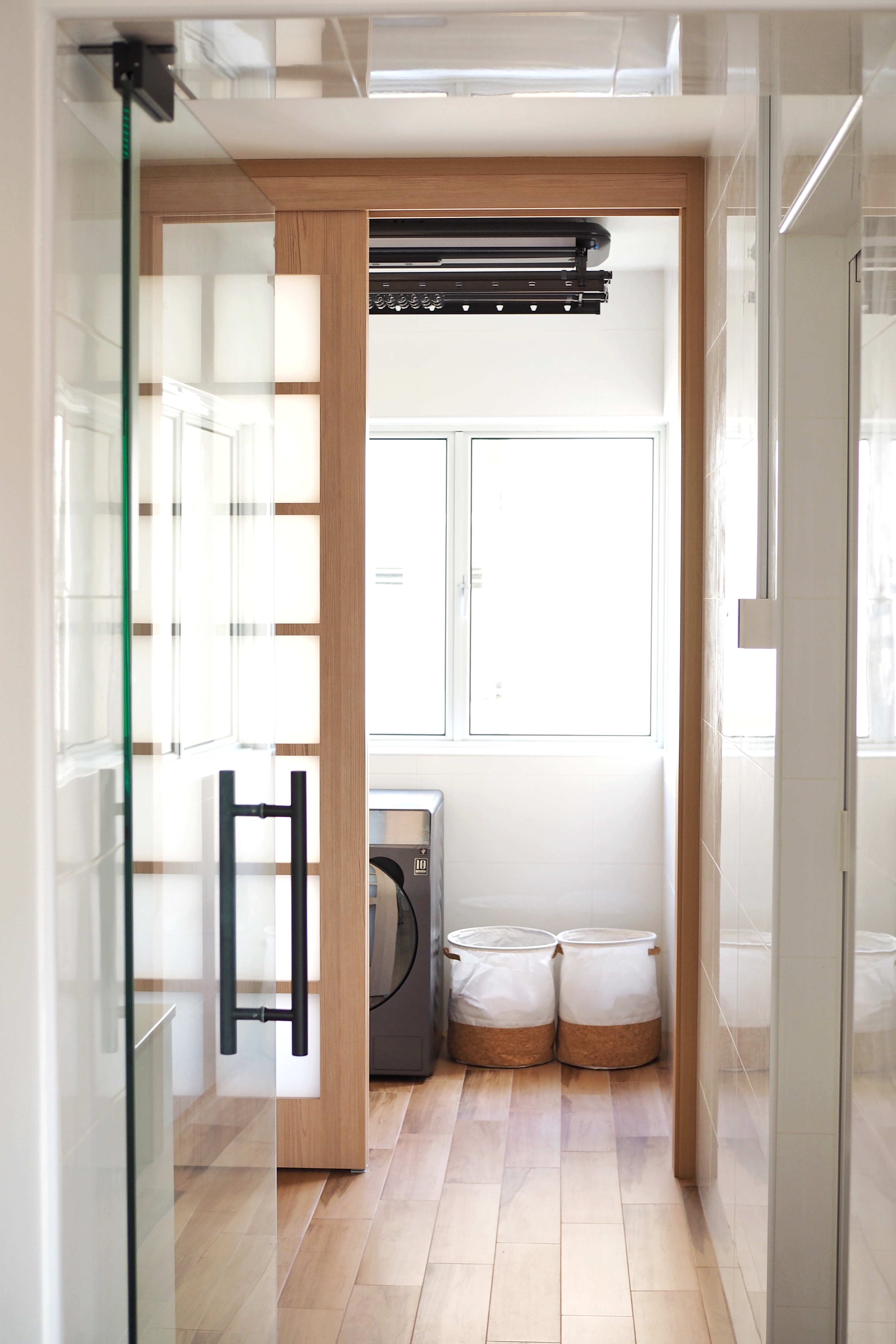 We Created A Service Yard! - Modern bathroom interior, glass shower door, wooden paneling, white tiled walls, large window