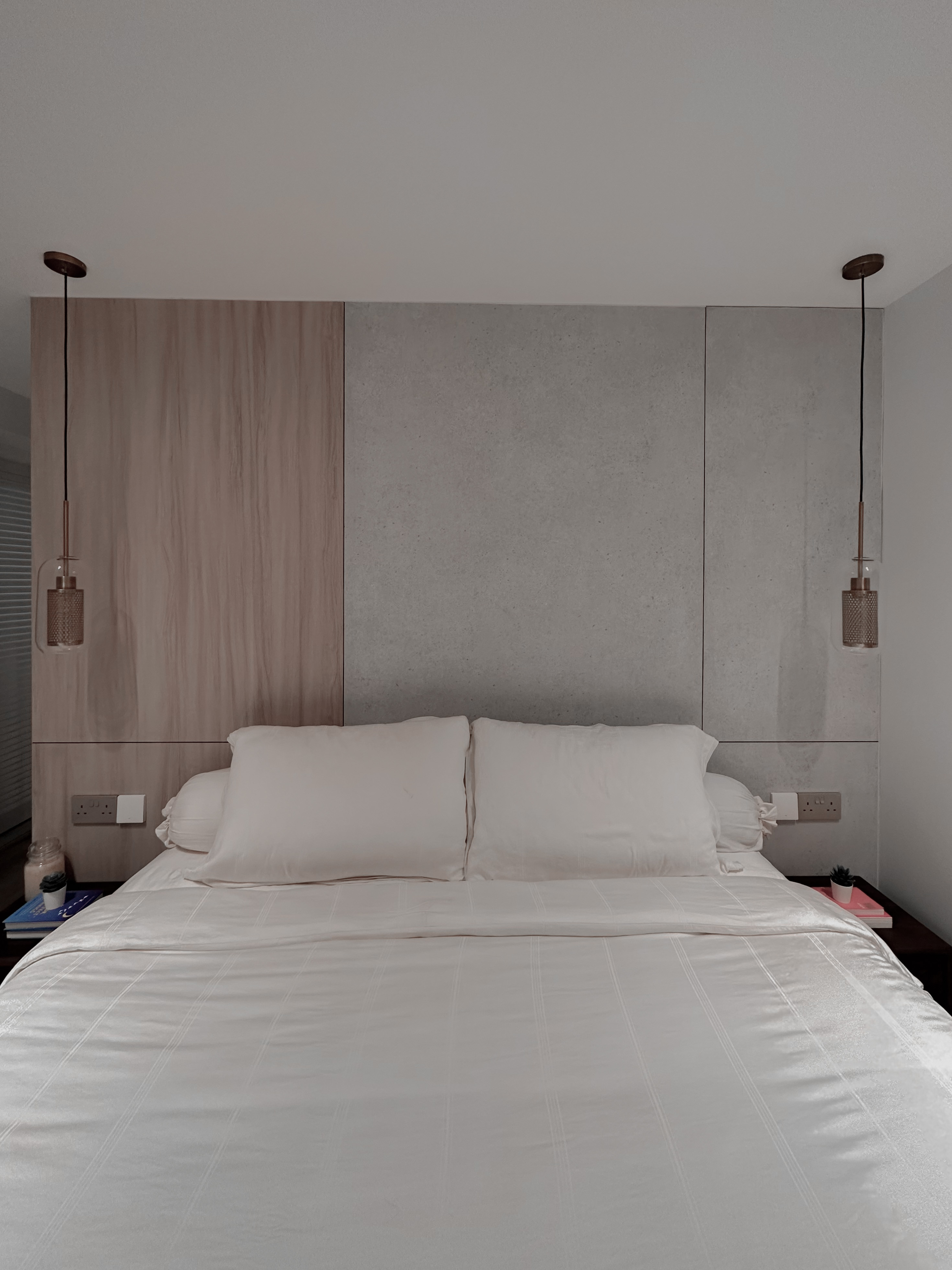 Beauty in Asymmetry: Cosy Lux Bedroom - modern bedroom, minimalist design, cozy bed, white bedding, wooden panel, gray accent