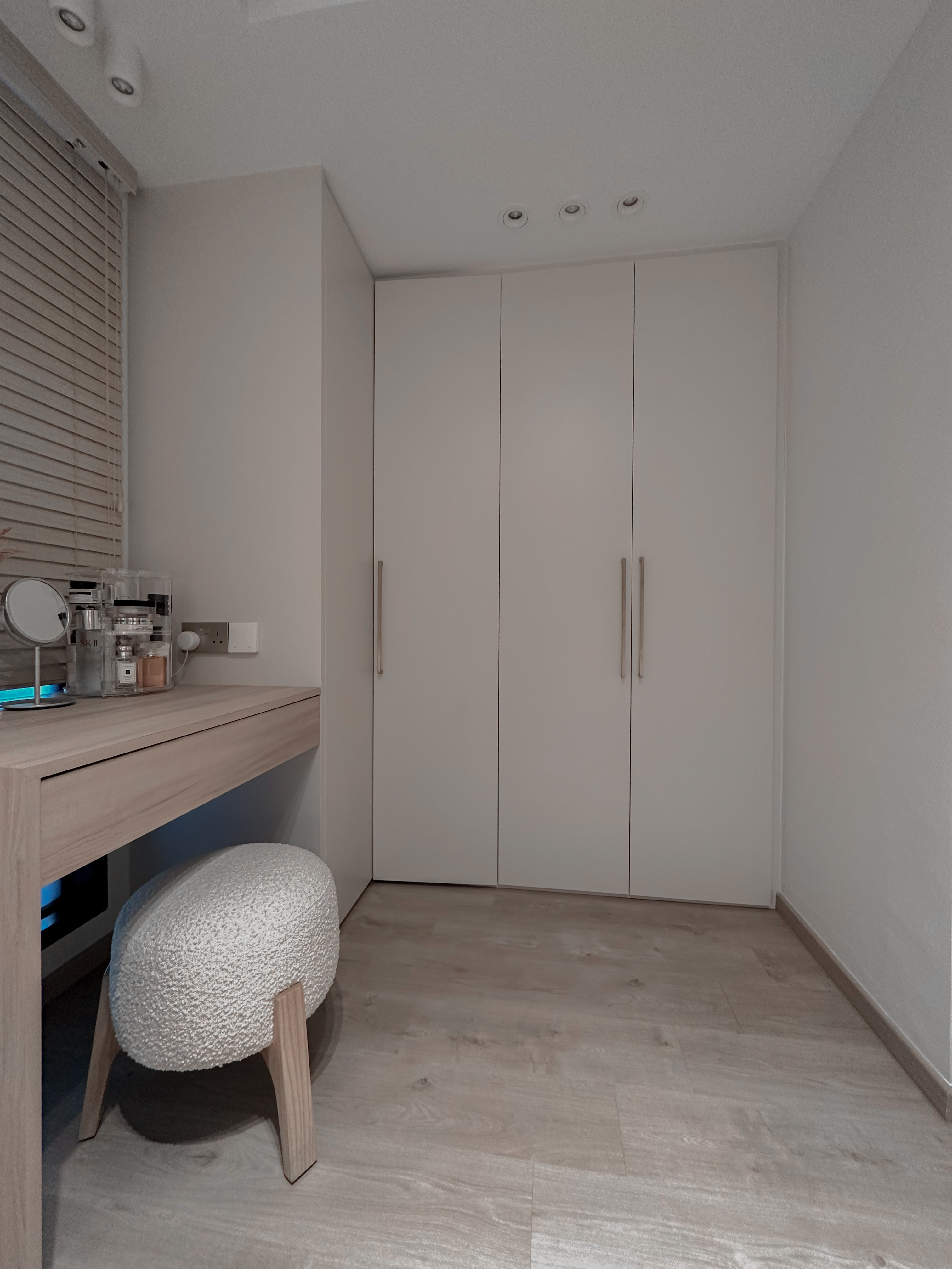 Beauty in Asymmetry: Cosy Lux Bedroom - Light wood desk, minimalist wardrobe, soft natural light, white cabinets, modern