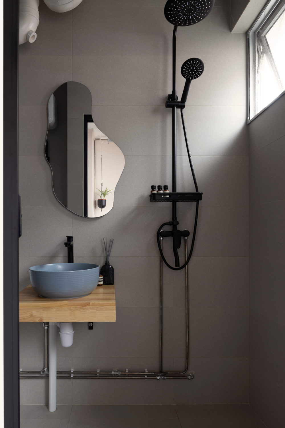 Bringing colour to small bathrooms - Modern minimalist bathroom, sleek design, contemporary fixtures, black showerhead and