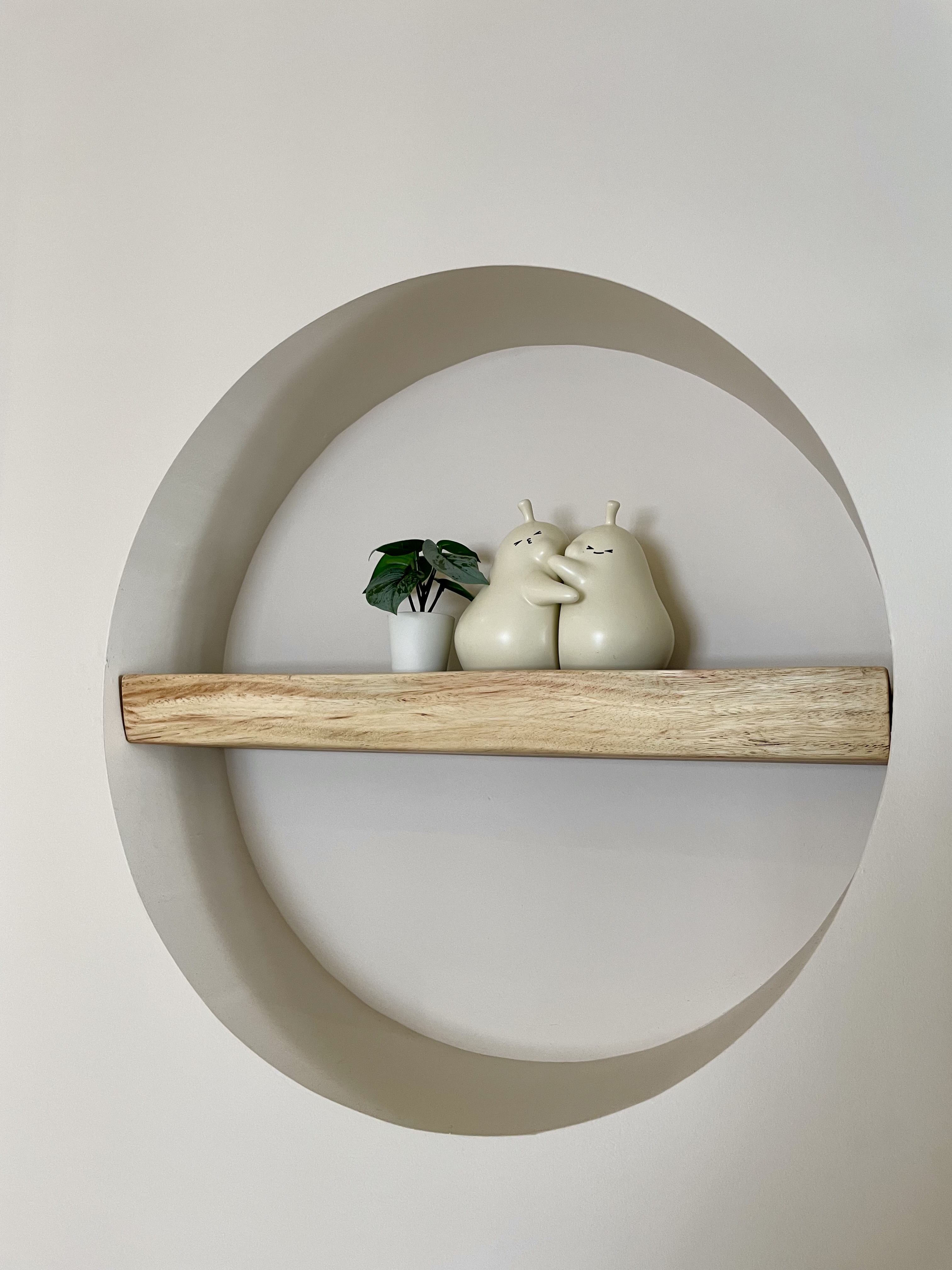 Simple Entryway with Shoe Shelves in DB Box  - White circular wall art, minimalist design, wooden shelf, abstract art piece