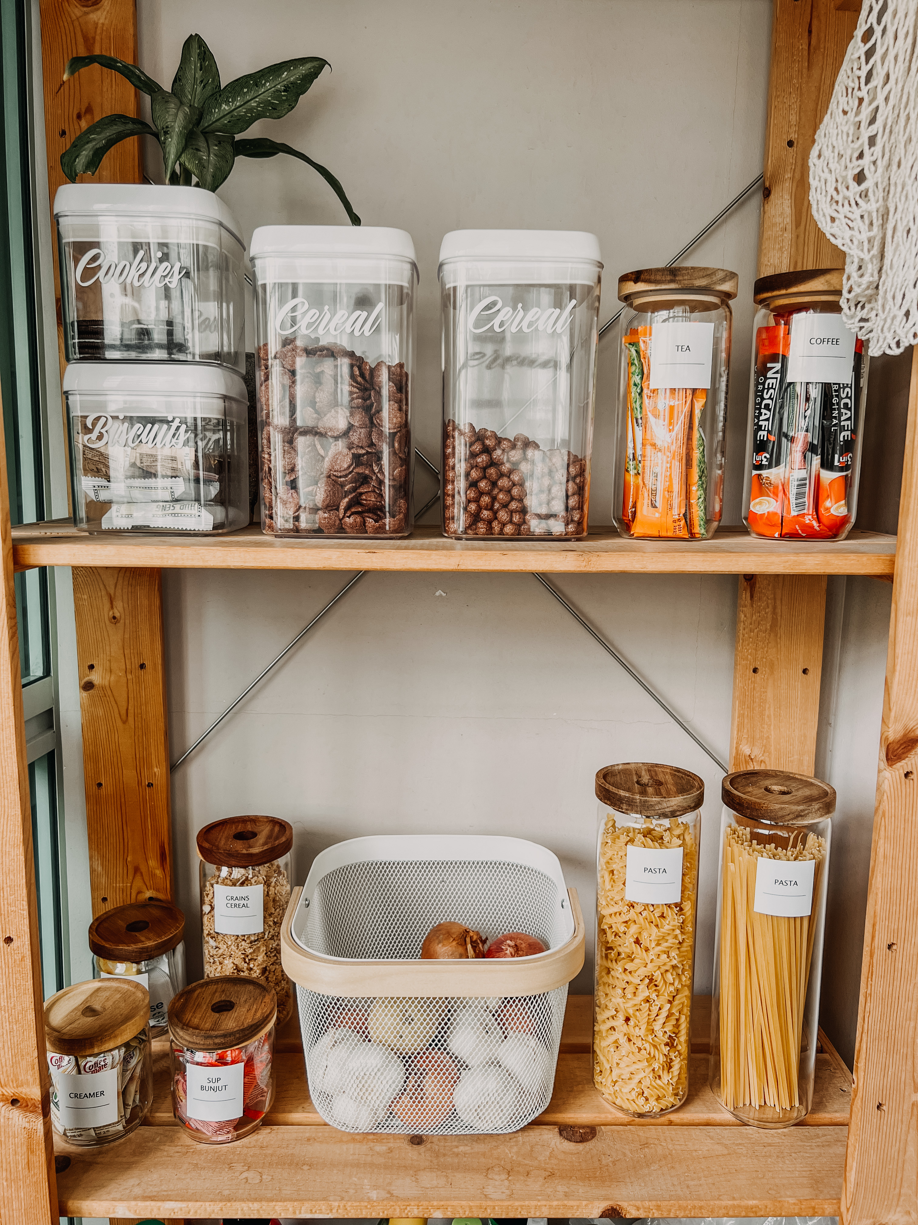 Make the most of your service yard - Glass jars labeled "Cookies, " "Biscuits, " "Cereal, " "Tea, " "Coffee, " "Nescafé, "