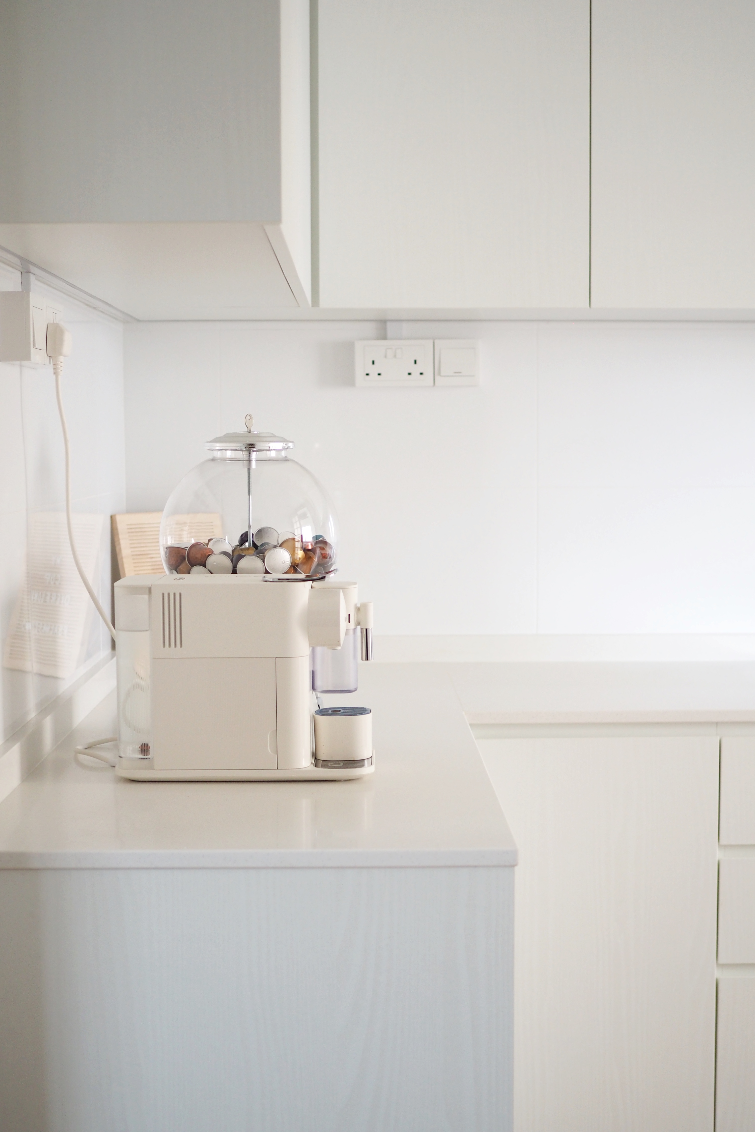 Kitchen for Coffee Lovers - White kitchen counter, modern appliances, minimalist design, white cabinets, sleek countertop
