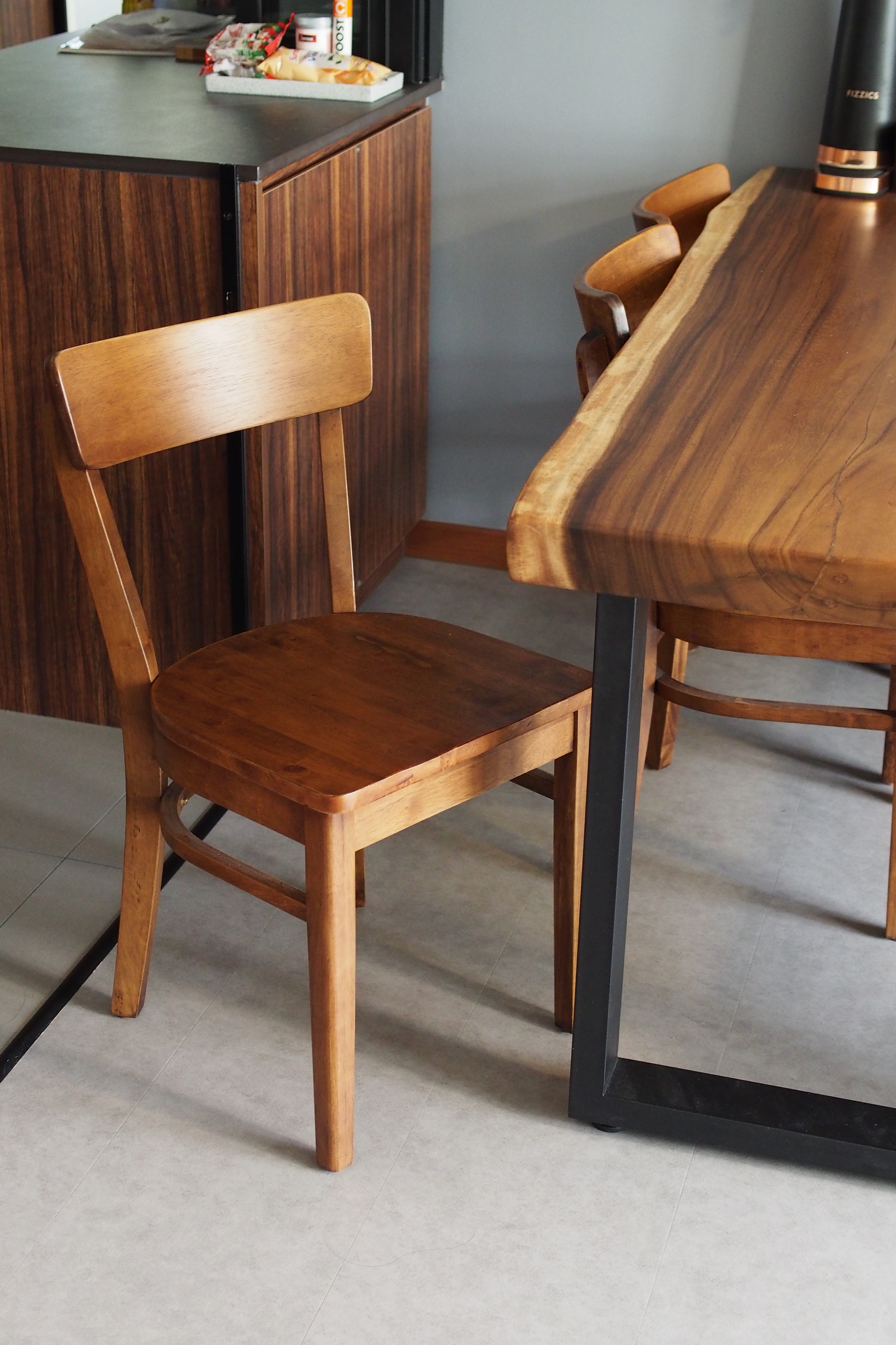 Adding a splash of colour to makan time - Wooden dining chairs, minimalist design, modern kitchen, wooden table, sleek black
