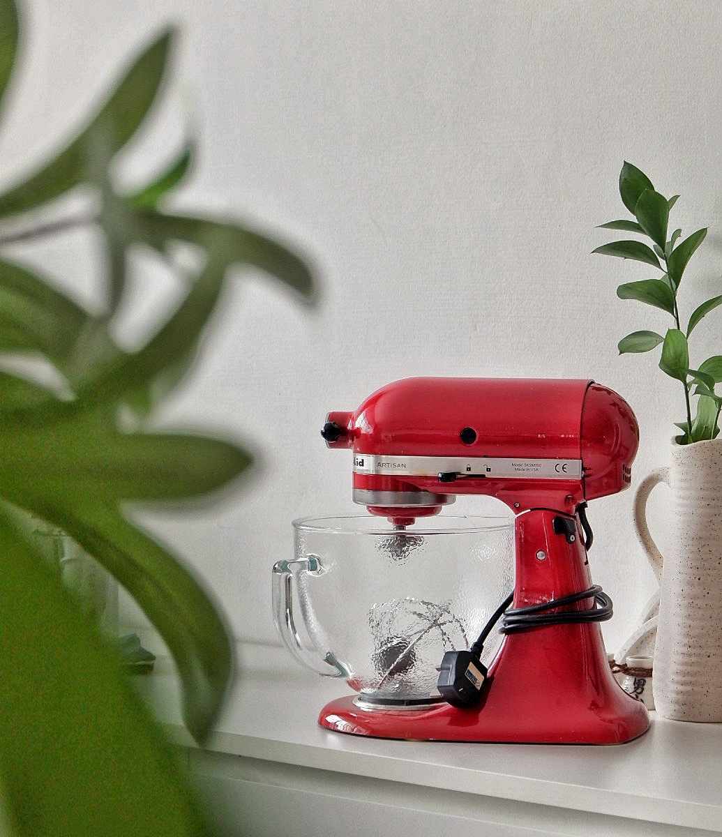 Kitchen purchases that I would recommend  - red stand mixer, modern kitchen, white countertop, clear mixing bowl, plant in