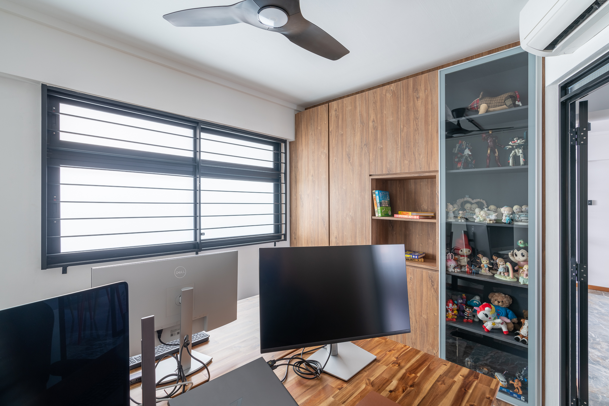 WFHappily Ever After - Modern home office, desk setup, computer monitors, ergonomic chair, natural light, wooden cabinets