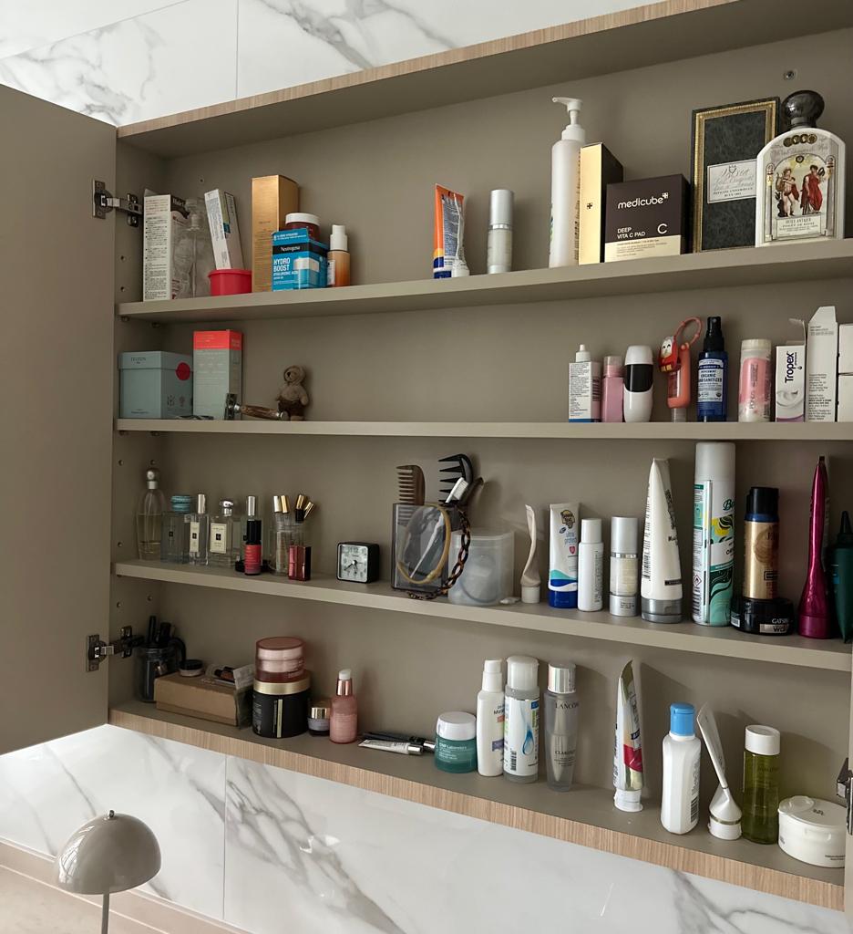 A light filled bathroom with lots of natural ventilation - Shelves, medicine, bottles, boxes, toiletries, grooming products