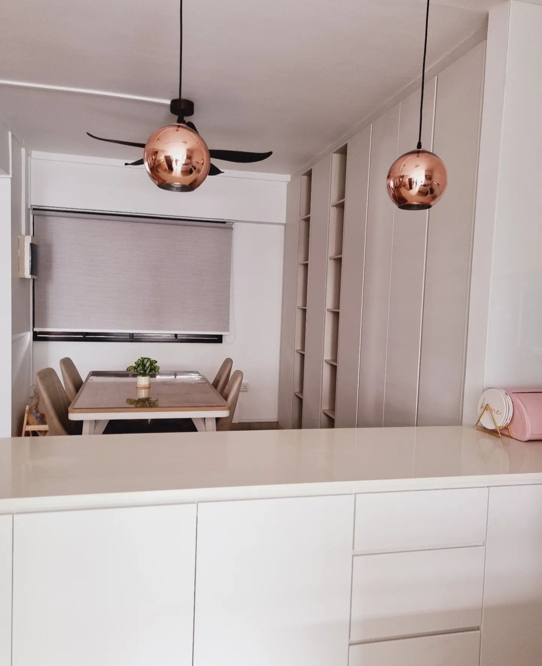 Our WHITE open kitchen - Modern dining room with minimalist design, copper pendant lights, white cabinets, dining table with
