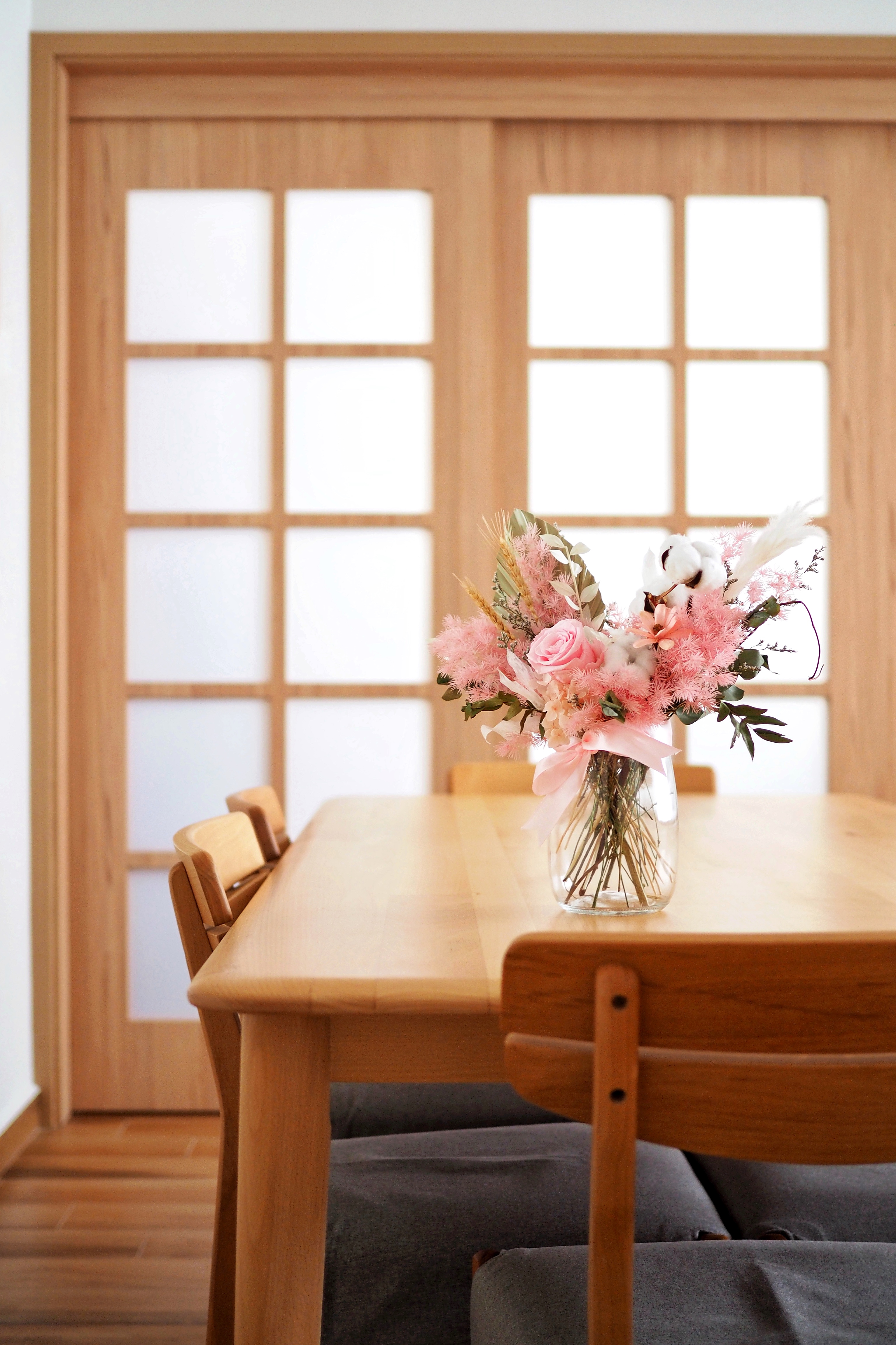Our Serene Dining Space - vase, floral arrangement, wooden dining table, natural light, pastel flowers, pink roses, white