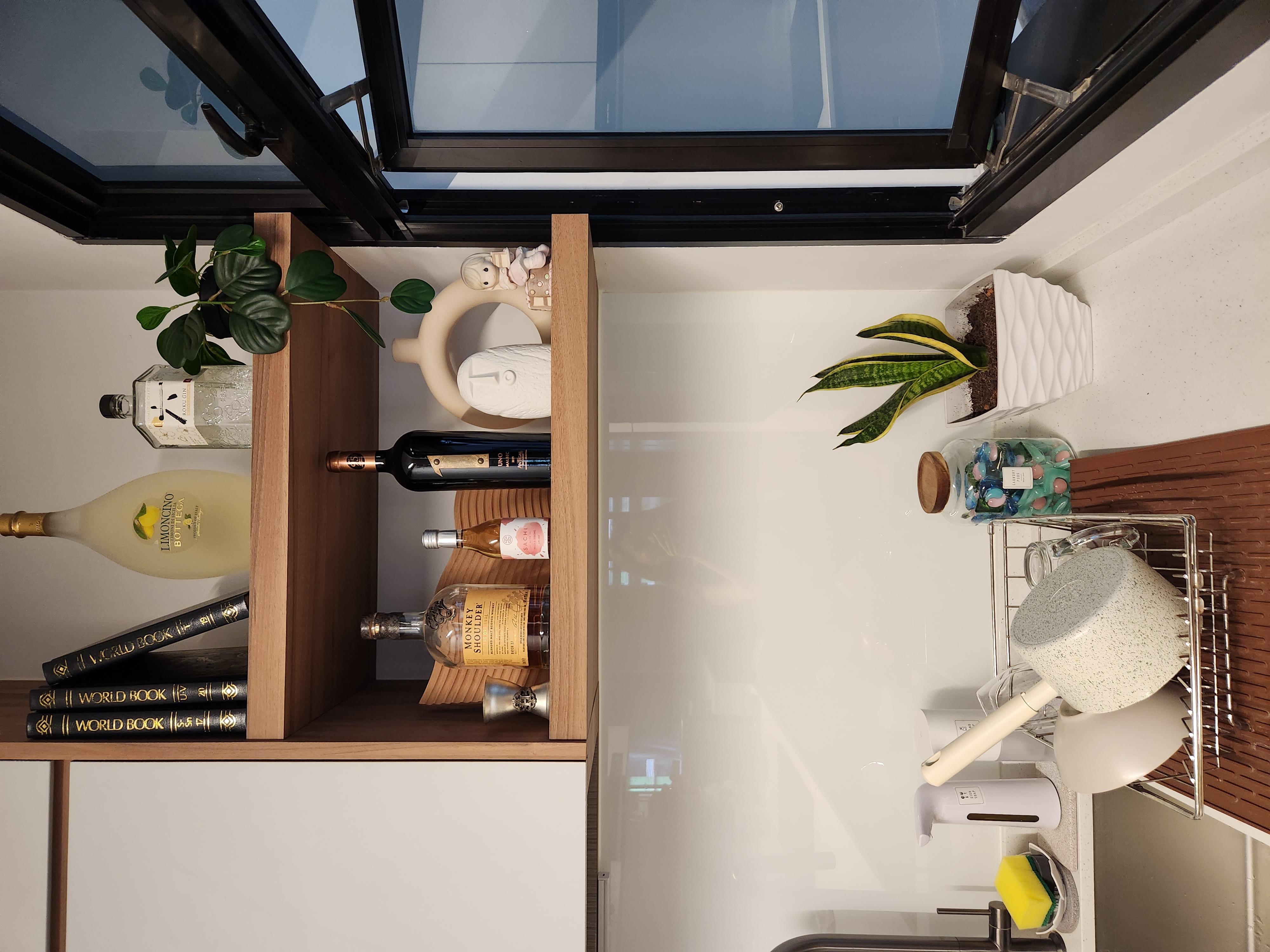 Slowly but surely | Our Faux Green Corners - Wooden shelf, glass bottle, white wine bottle, black wine bottle, yellow