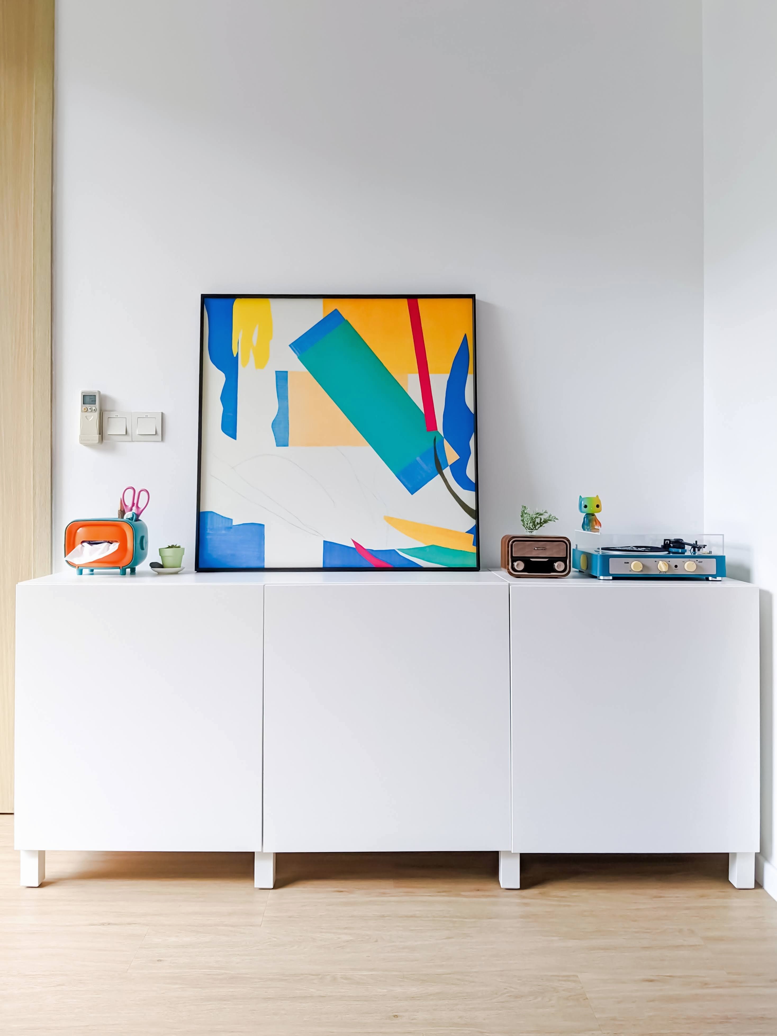 Vibrant Living Room With An Orange Sofa & Yellow Elephant Leg Chair