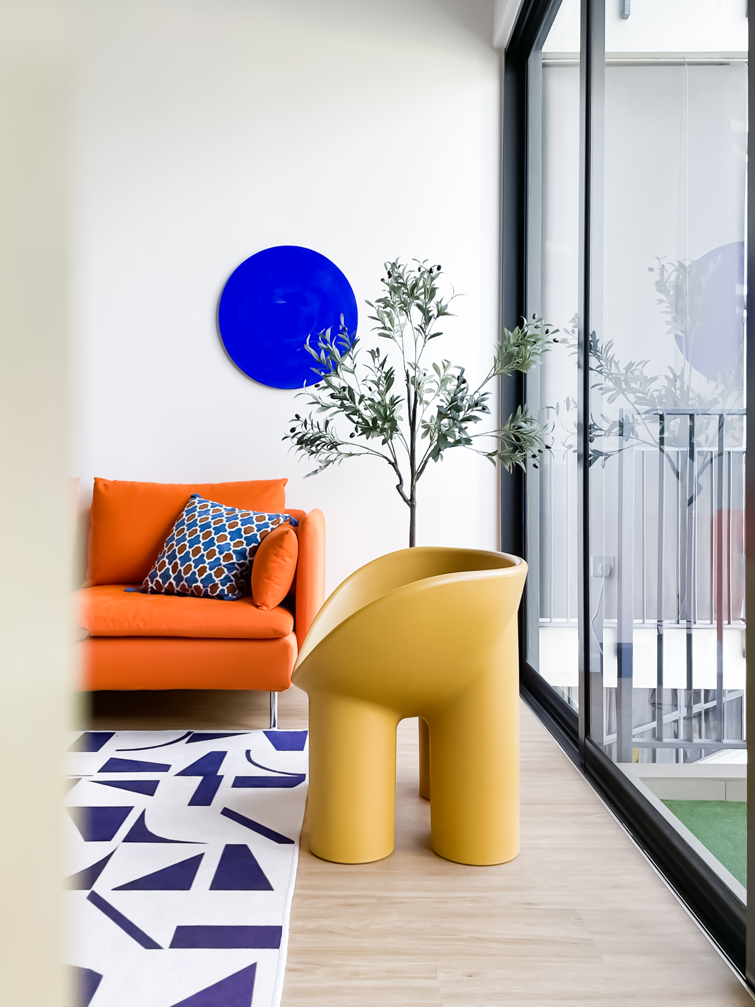 Vibrant-Living-Room-With-An-Orange-Sofa-&-Yellow-Elephant-Leg-Chair