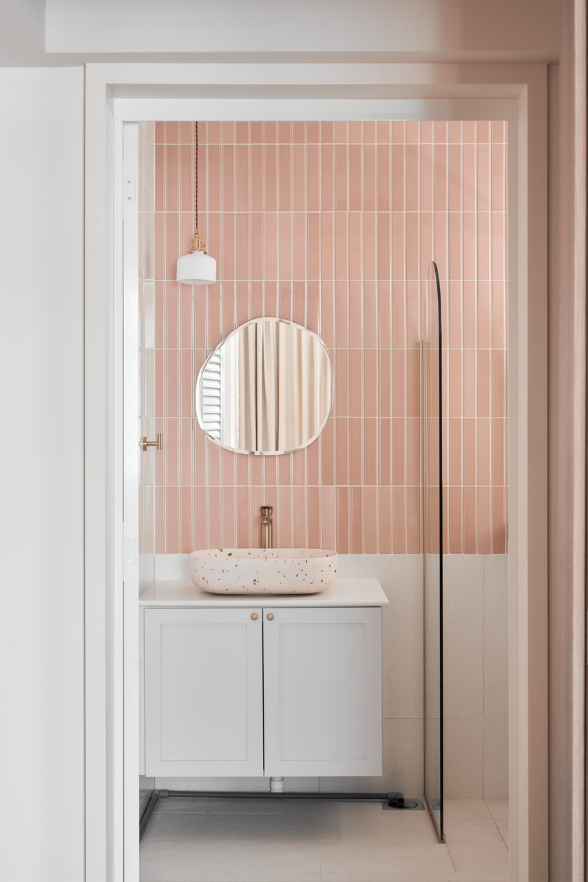 Dream Pink Bathroom without overlaying all walls - Pink-tiled bathroom vanity, modern design, white cabinet, oval mirror