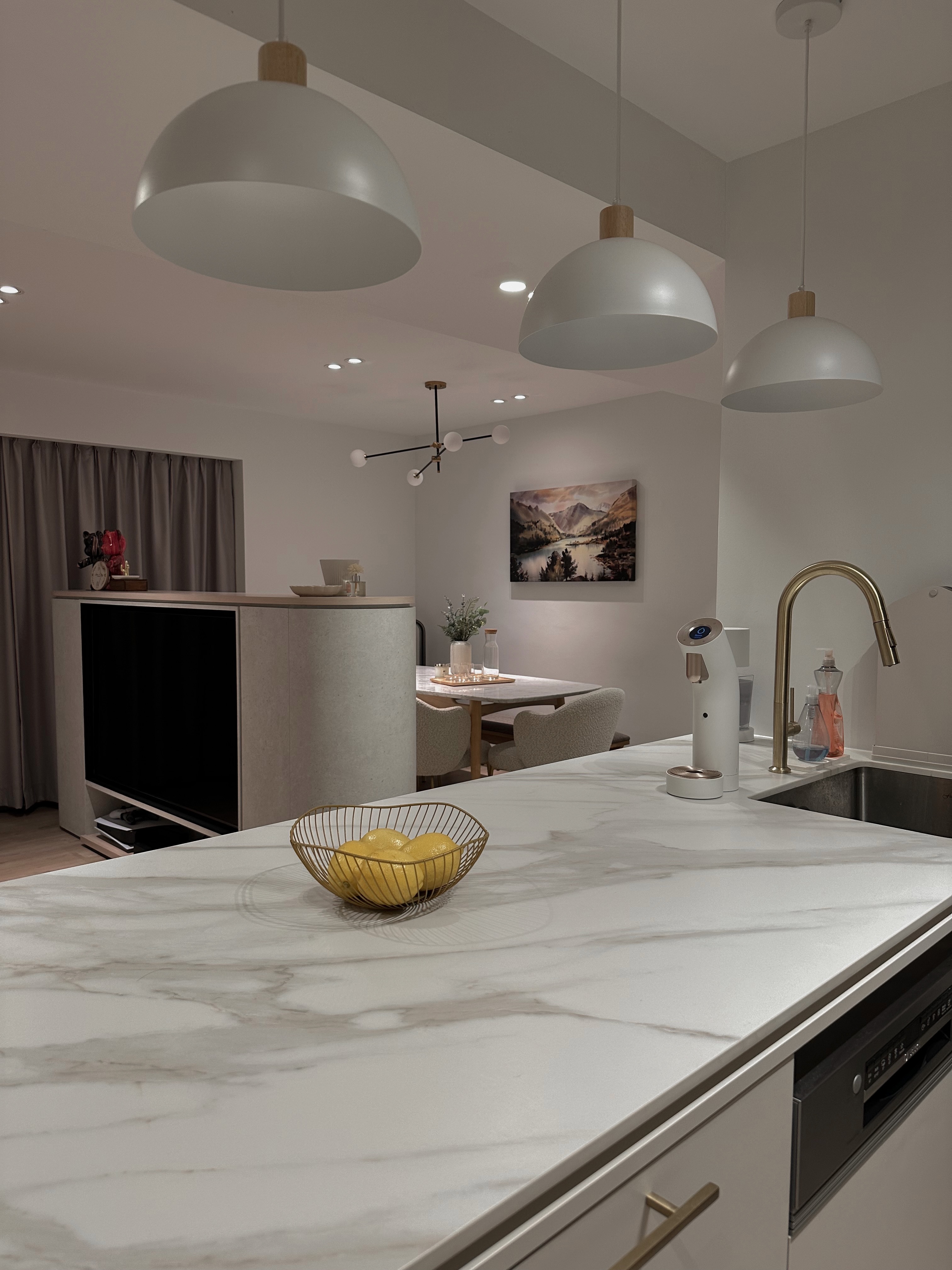 Our Minimalist Open Kitchen - Modern kitchen with marble countertops, sleek appliances, minimalist design, dining area in